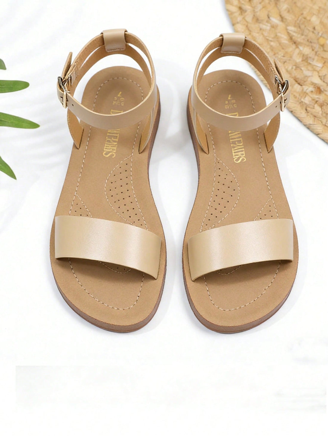 Apricot women's one-band flat sandals with open toe, slingback ankle strap, and adjustable buckle closure.