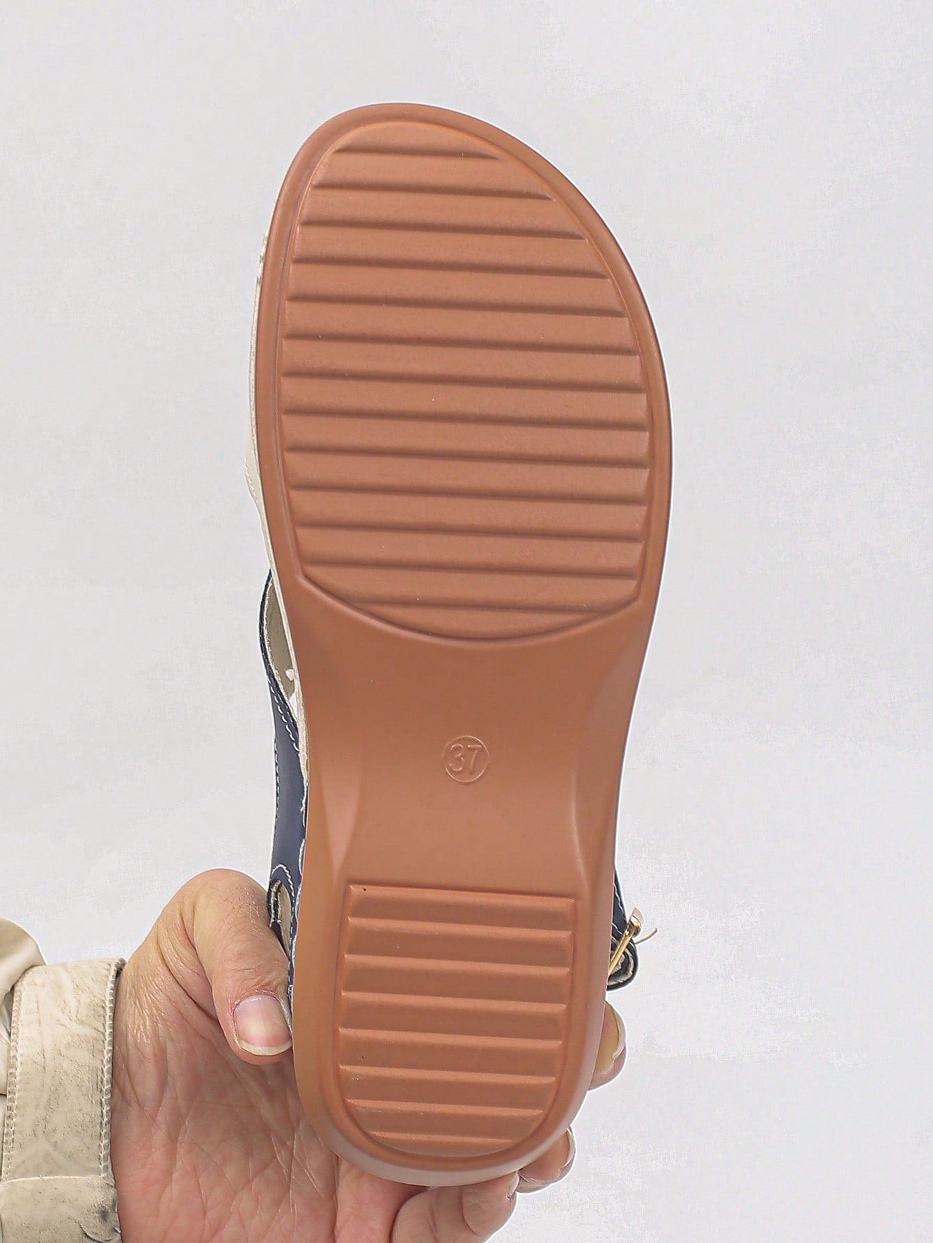 Women's bohemian wedge slide sandals with open toe, low wedge heel, slip-on design, and metal detail, available in plus sizes 36-43.