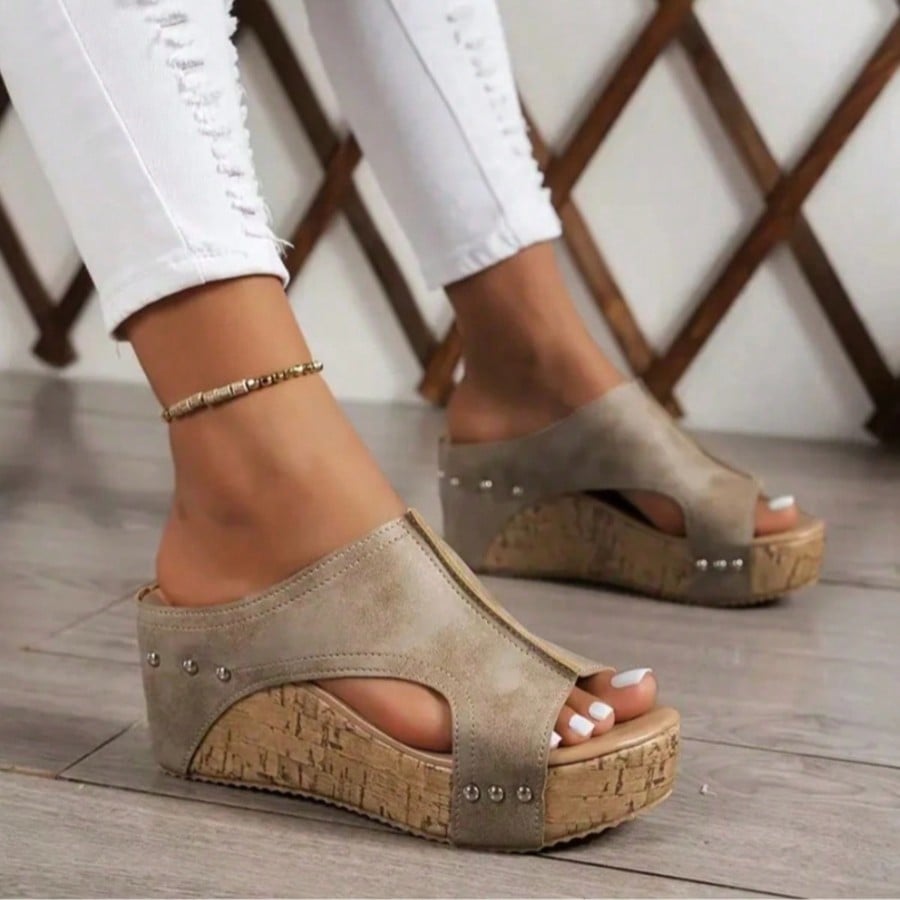 Women's plain slip-on slippers with a round toe, platform sole, and studded details, designed for casual daily wear and vacation outfits.