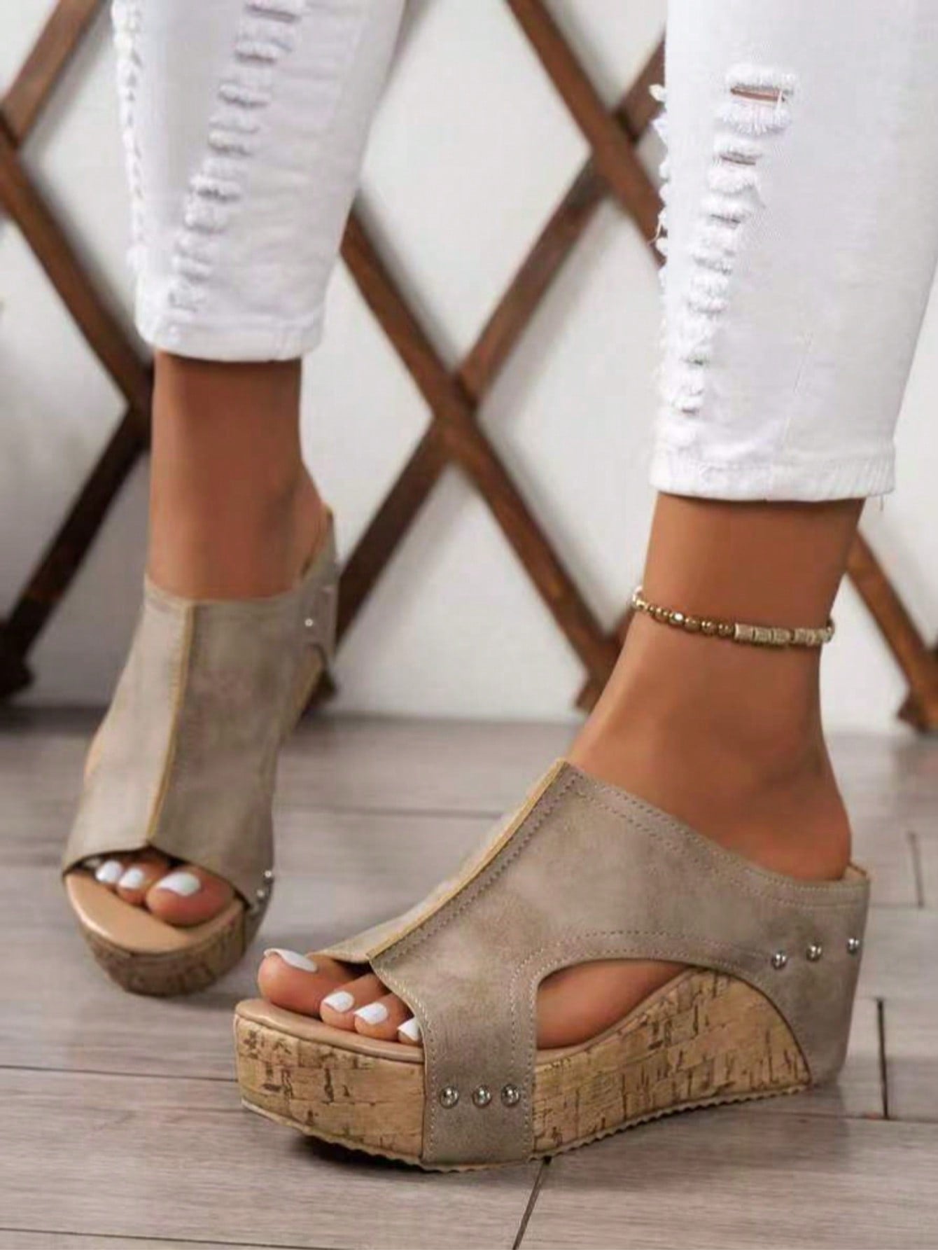 Women's plain slip-on slippers with a round toe, platform sole, and studded details, designed for casual daily wear and vacation outfits.