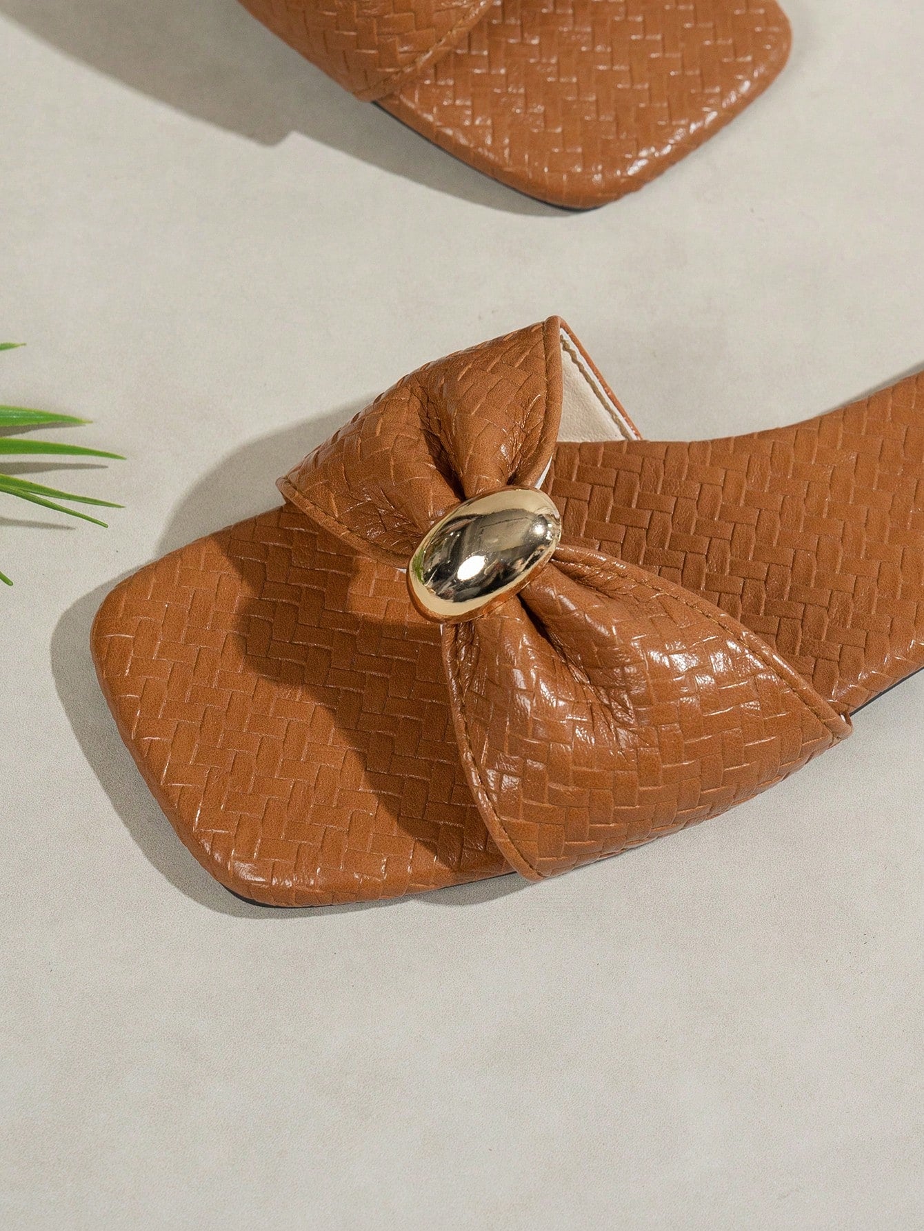 Women's ginger woven flat slide sandals with open toe, bow knot detail, and metal decor in a minimalist beach style.