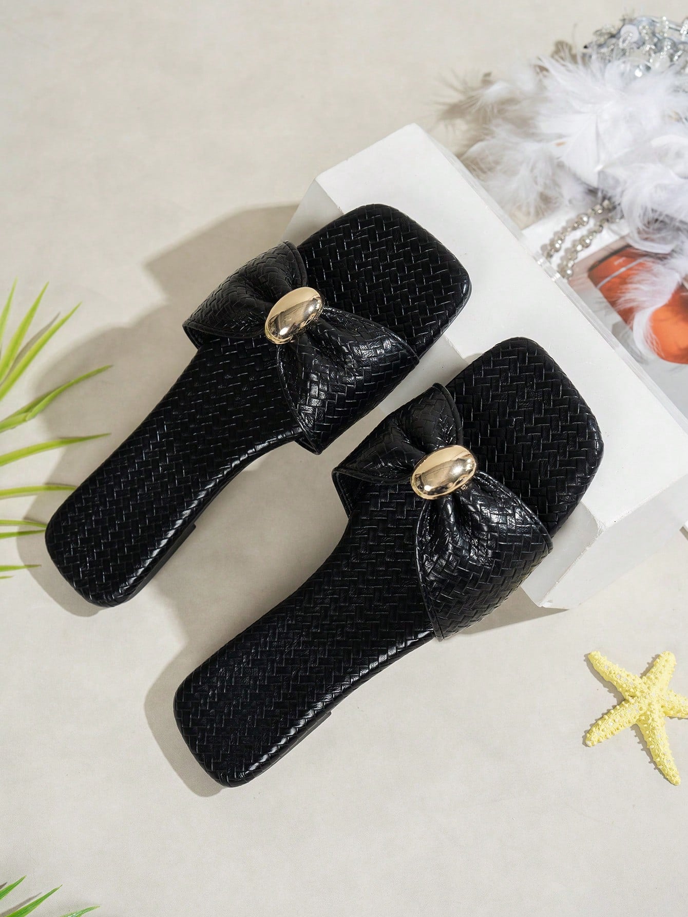 Women's ginger woven flat slide sandals with open toe, bow knot detail, and metal decor in a minimalist beach style.