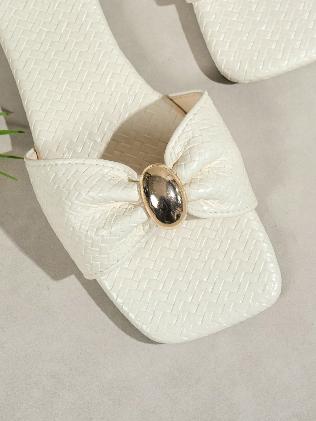 Women's ginger woven flat slide sandals with open toe, bow knot detail, and metal decor in a minimalist beach style.