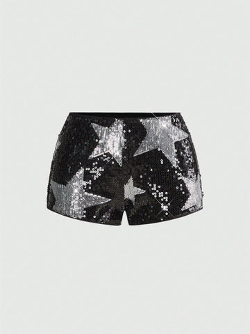Women's black sequin ultra low-waist mini shorts with sparkling pentagram decor, zipper detail, and elastic waist for party, stage, concert, or Halloween wear