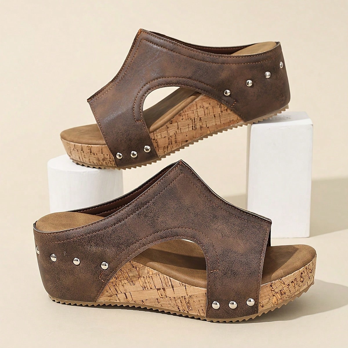 Women's plain slip-on slippers with a round toe, platform sole, and studded details, designed for casual daily wear and vacation outfits.