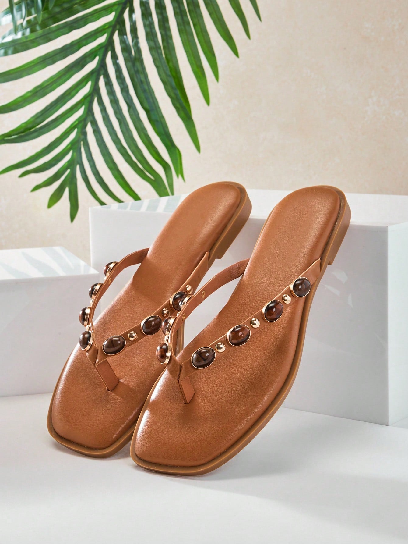 Women's gold metallic PU flip-flop thong sandals with square toe, toe-post front, and tiger eye gemstone decor with turquoise texture detail.