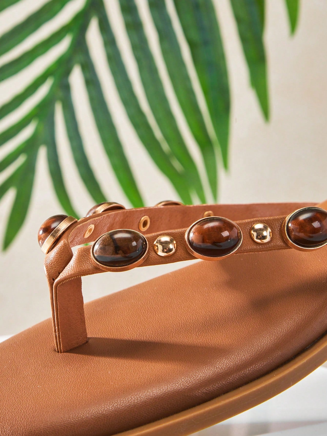 Women's gold metallic PU flip-flop thong sandals with square toe, toe-post front, and tiger eye gemstone decor with turquoise texture detail.