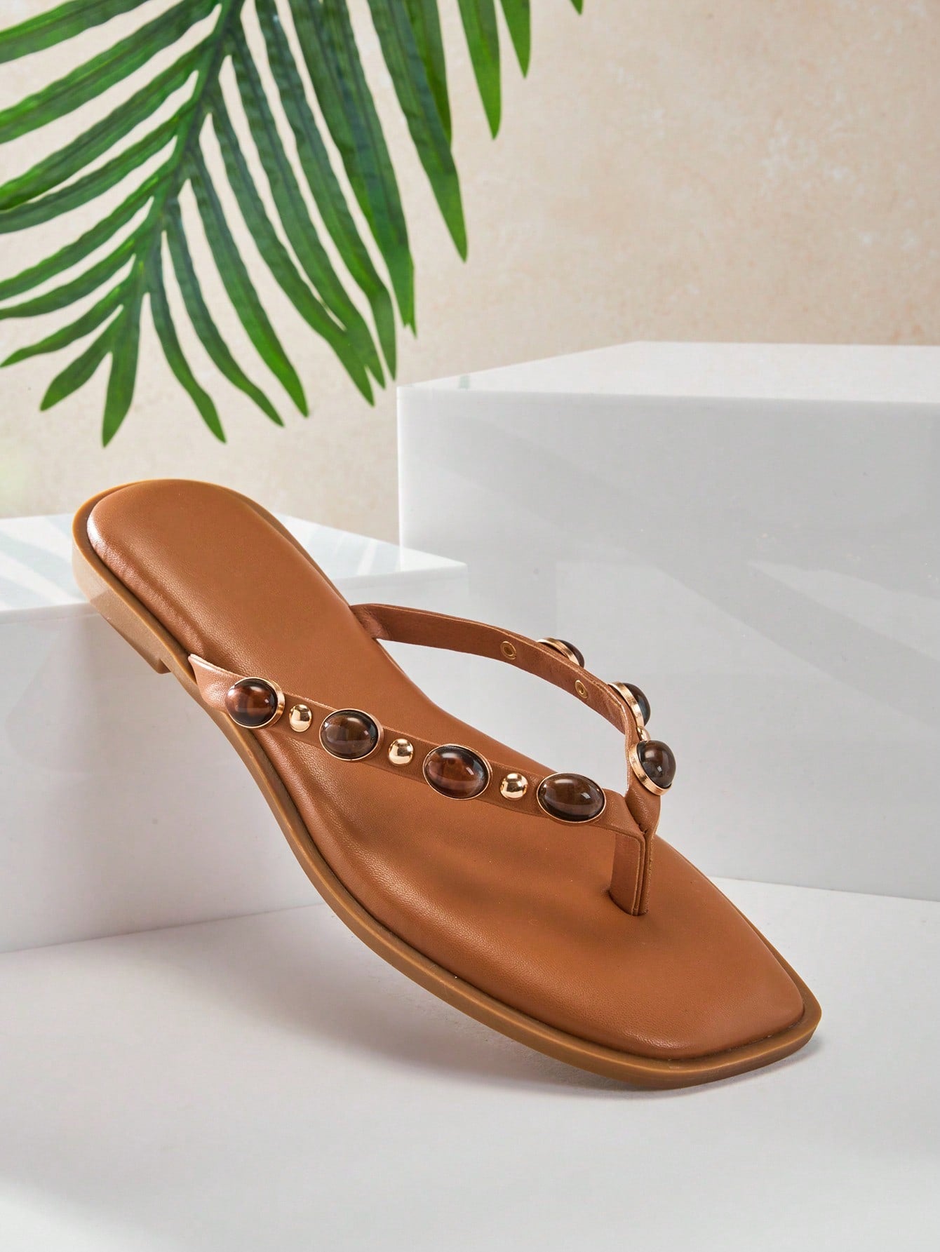 Women's gold metallic PU flip-flop thong sandals with square toe, toe-post front, and tiger eye gemstone decor with turquoise texture detail.