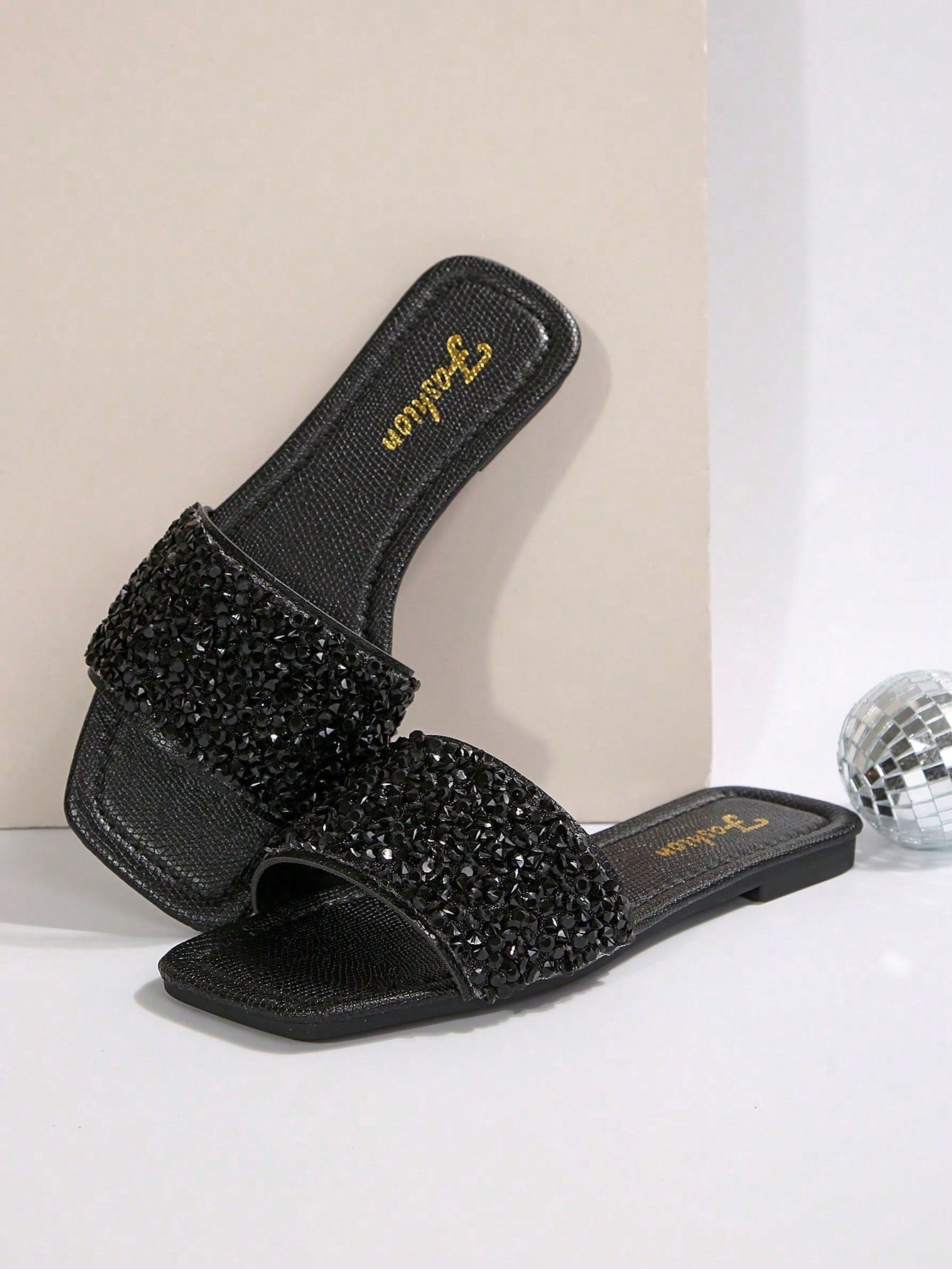 Black plus size women's slip-on flat slide sandals with square open toe, soft non-slip sole, and pearl rhinestone embellishments.