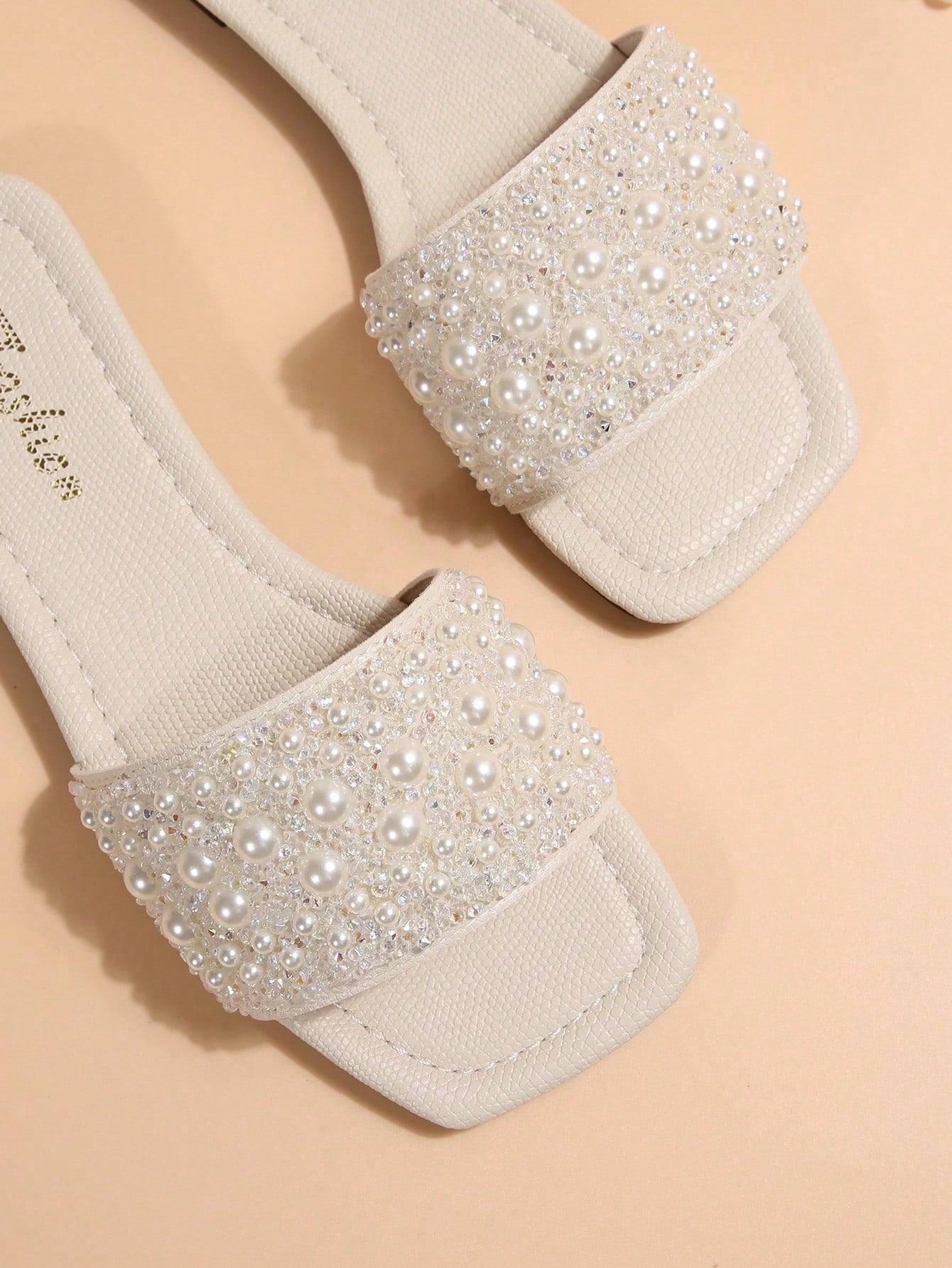 Black plus size women's slip-on flat slide sandals with square open toe, soft non-slip sole, and pearl rhinestone embellishments.