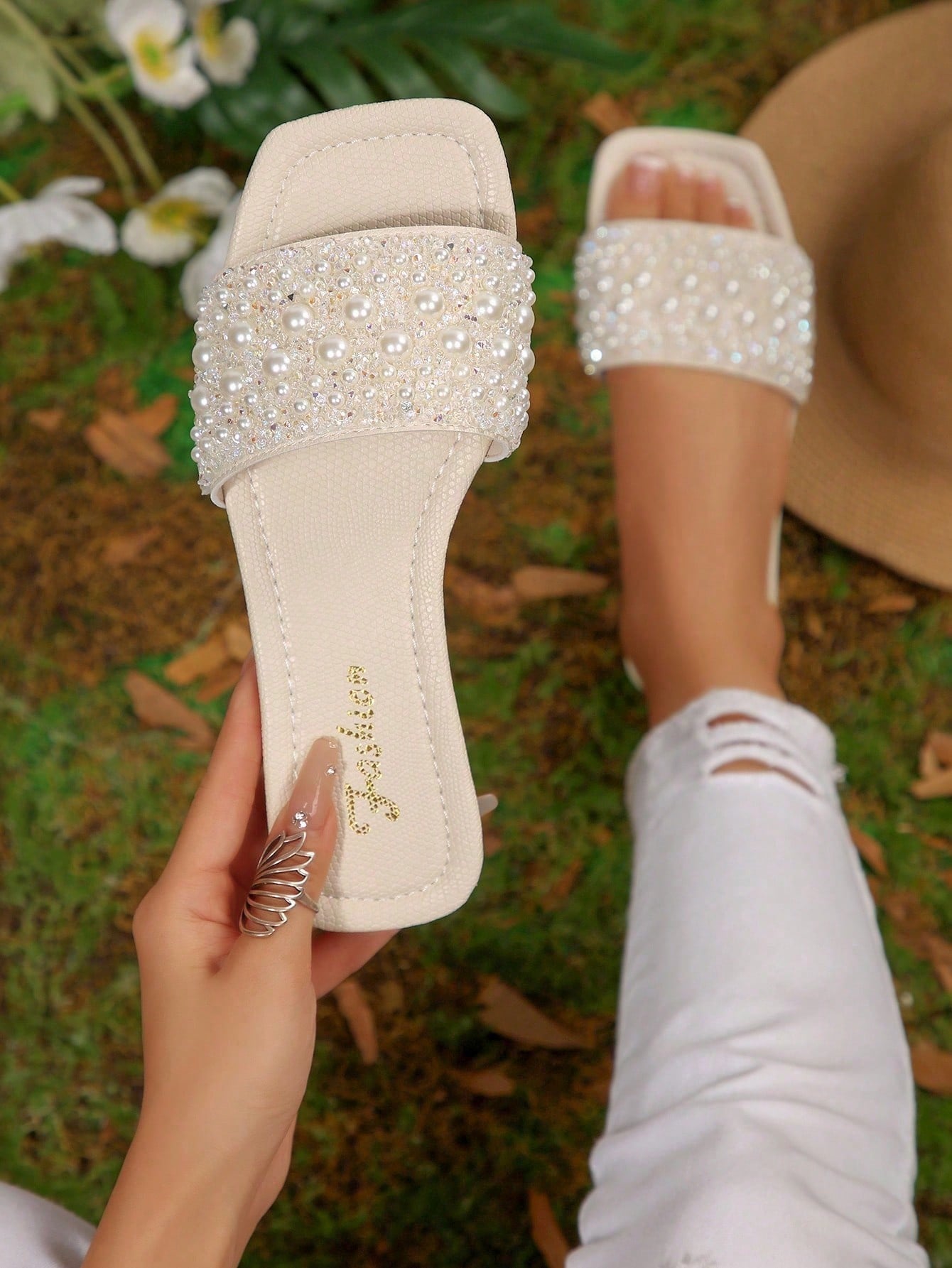 Black plus size women's slip-on flat slide sandals with square open toe, soft non-slip sole, and pearl rhinestone embellishments.
