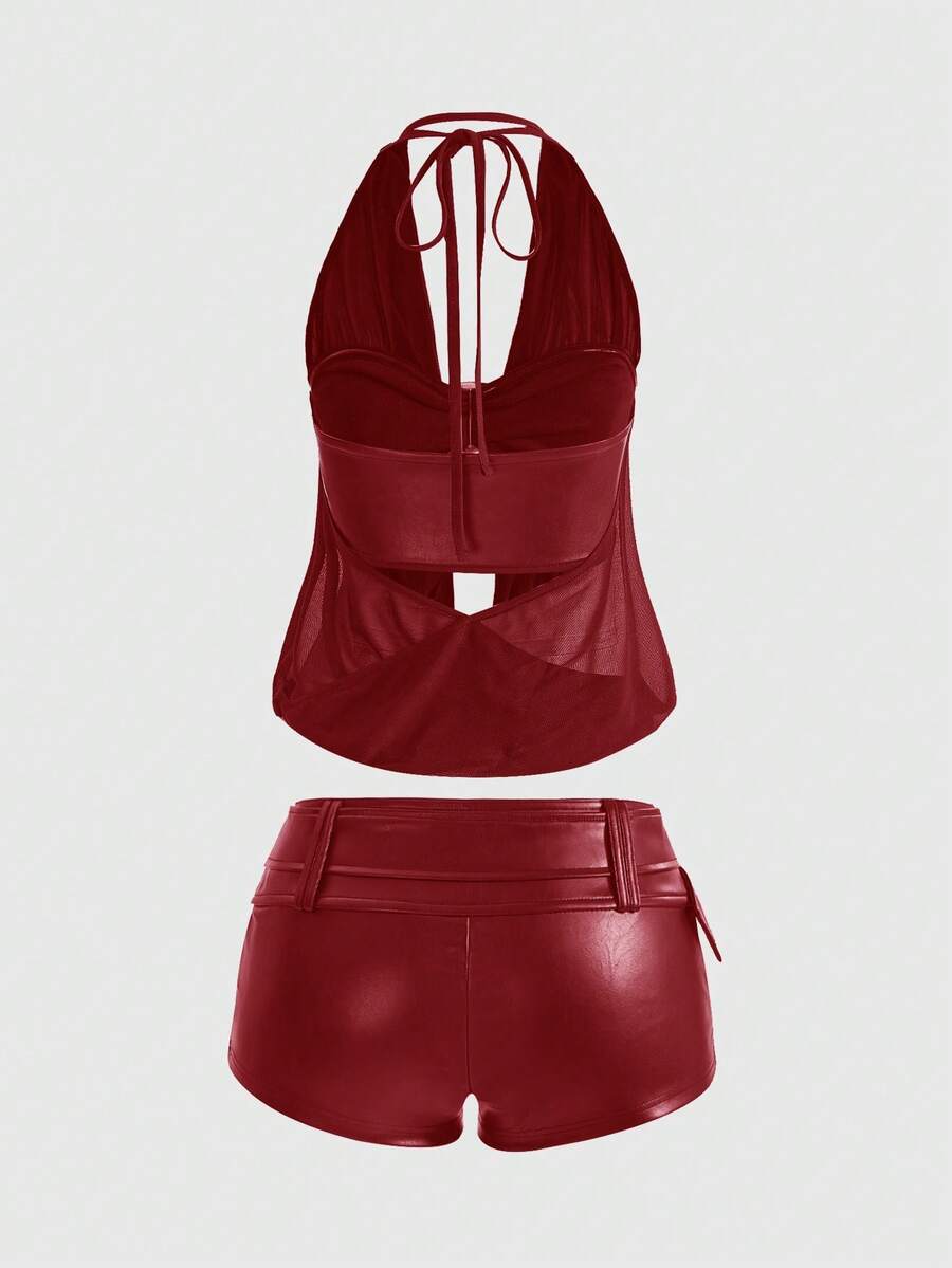 Women's Gyaru-style two-piece outfit with a draped halter crop top, backless tie detail, and mini bodycon shorts