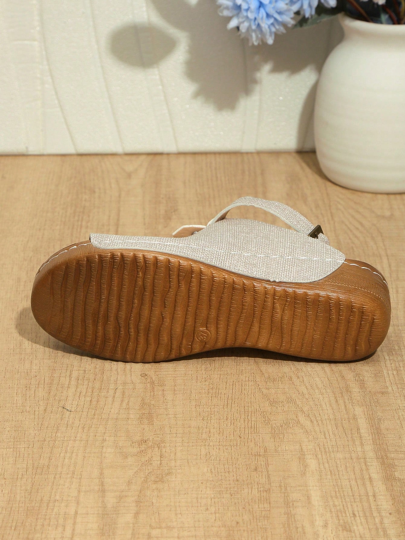 Women's open-toe platform wedge beach sandals with thick sole, stitching detail, floral accents, buckle closure, and removable adjustable shoelaces.