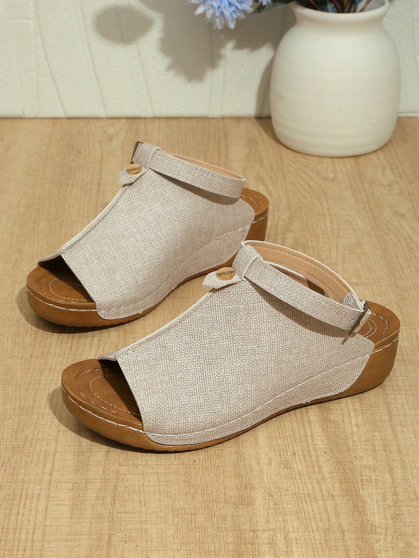 Women's open-toe platform wedge beach sandals with thick sole, stitching detail, floral accents, buckle closure, and removable adjustable shoelaces.