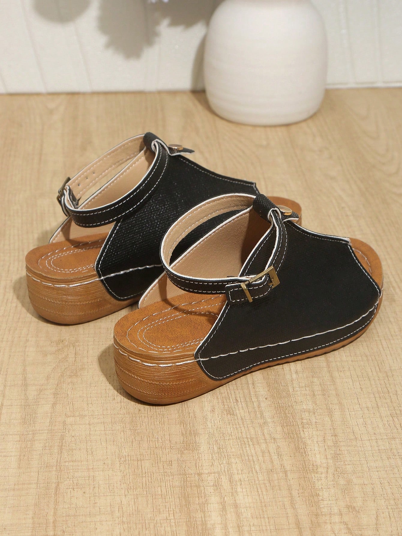 Women's open-toe platform wedge beach sandals with thick sole, stitching detail, floral accents, buckle closure, and removable adjustable shoelaces.