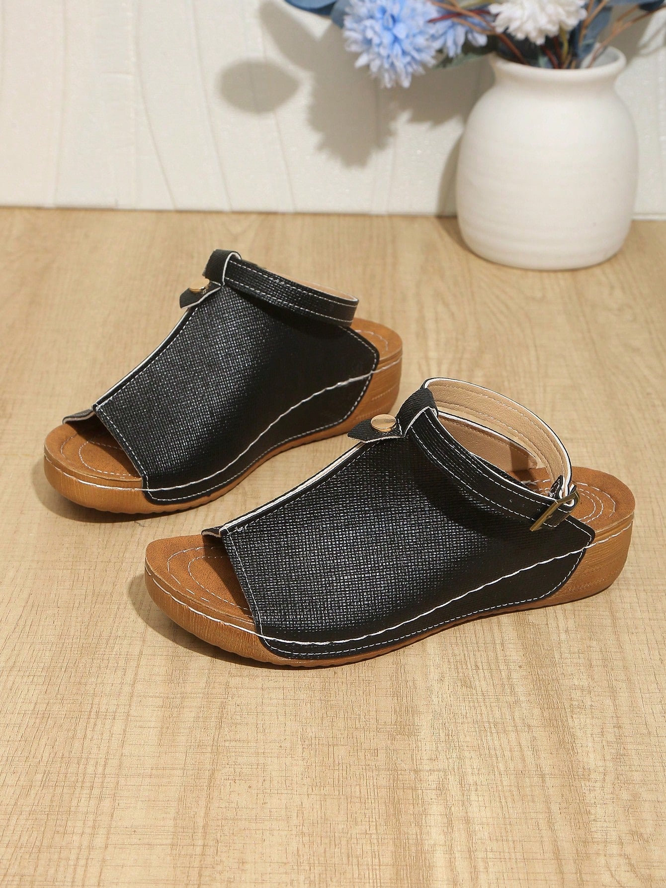 Women's open-toe platform wedge beach sandals with thick sole, stitching detail, floral accents, buckle closure, and removable adjustable shoelaces.