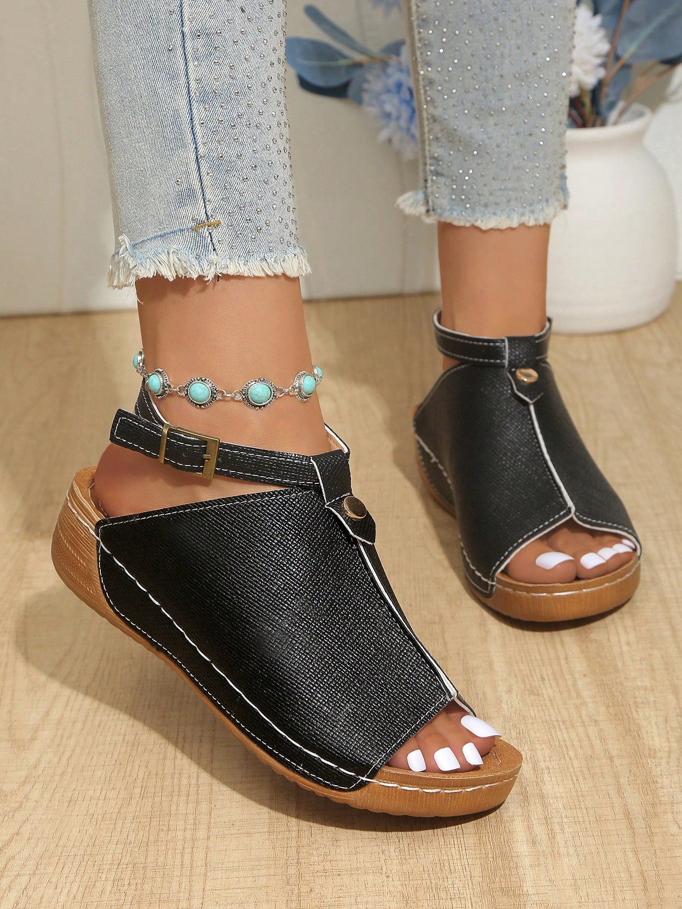 Women's open-toe platform wedge beach sandals with thick sole, stitching detail, floral accents, buckle closure, and removable adjustable shoelaces.