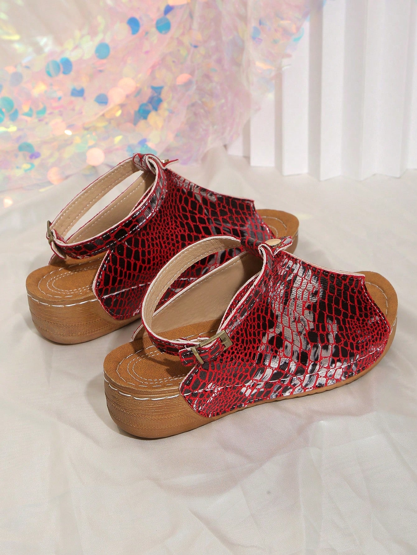 Women's open-toe platform wedge beach sandals with thick sole, stitching detail, floral accents, buckle closure, and removable adjustable shoelaces.