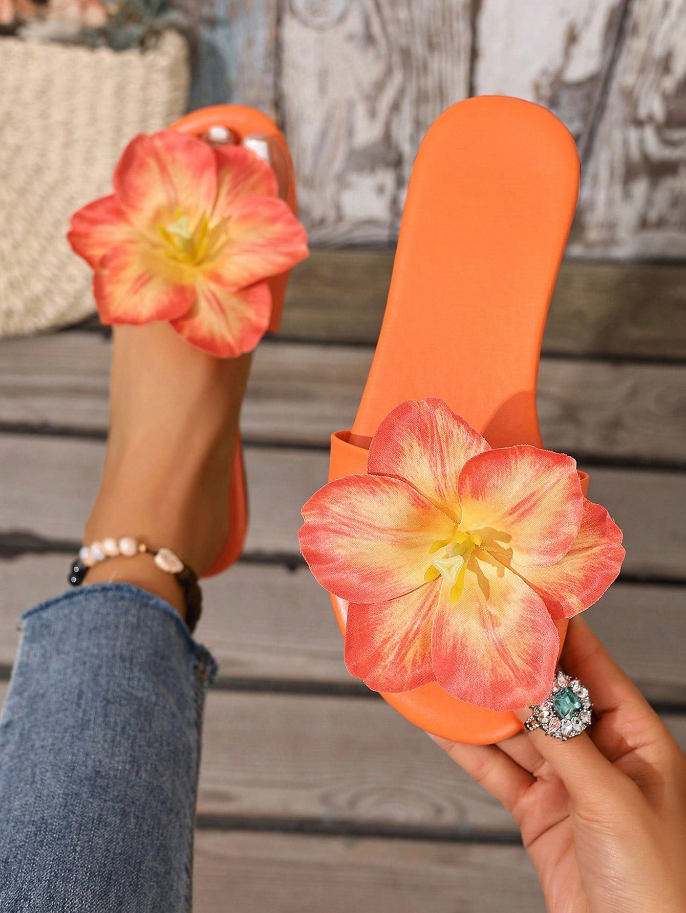 Women’s French floral flat slip-on sandals in orange with open-toe slide design and flat sole