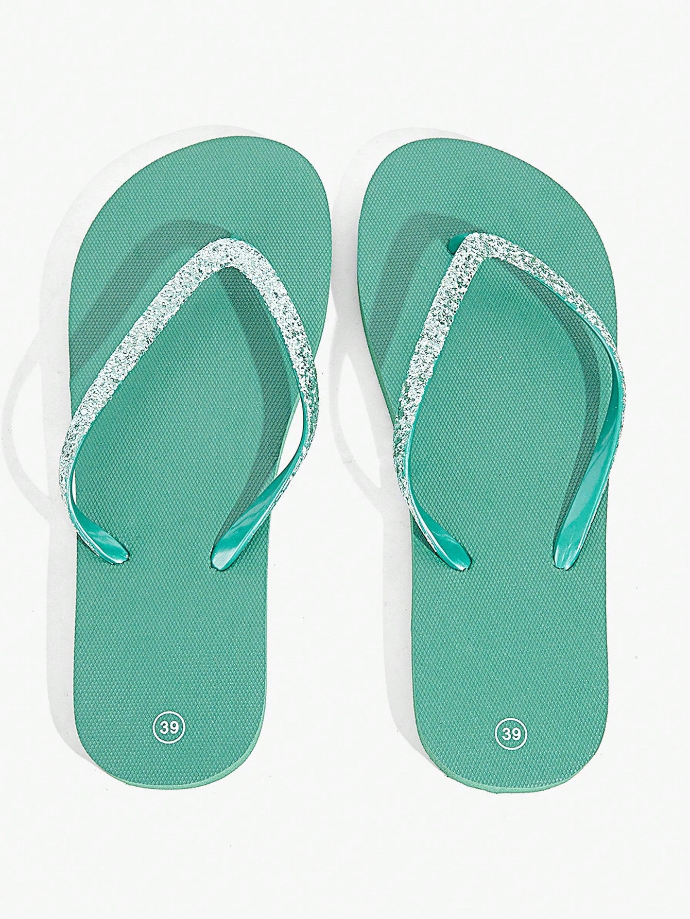 Pair of women’s apricot flat flip-flops with a glitter upper and plain design, suitable for beach, outdoor, home, and vacation wear.