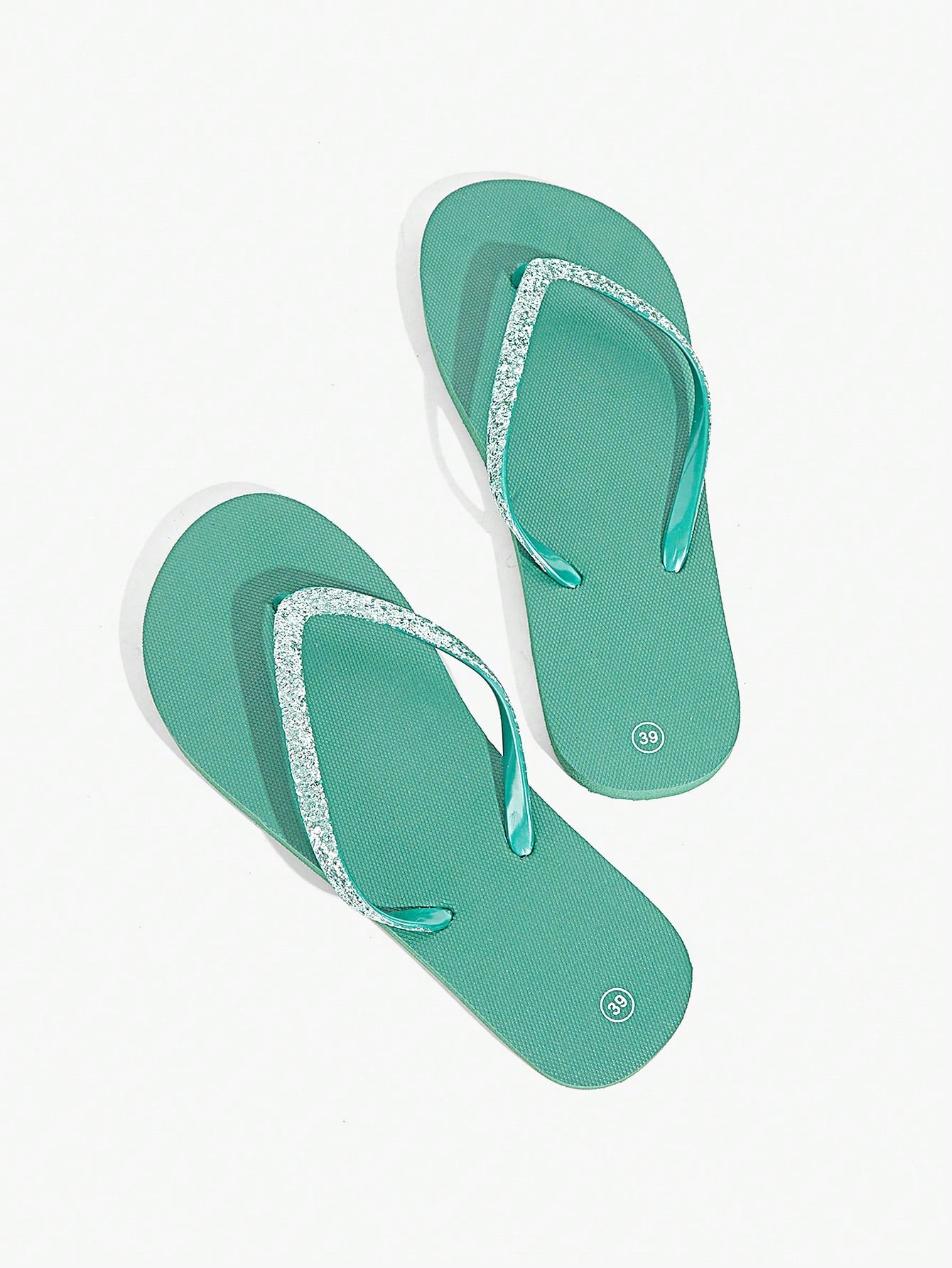 Pair of women’s apricot flat flip-flops with a glitter upper and plain design, suitable for beach, outdoor, home, and vacation wear.