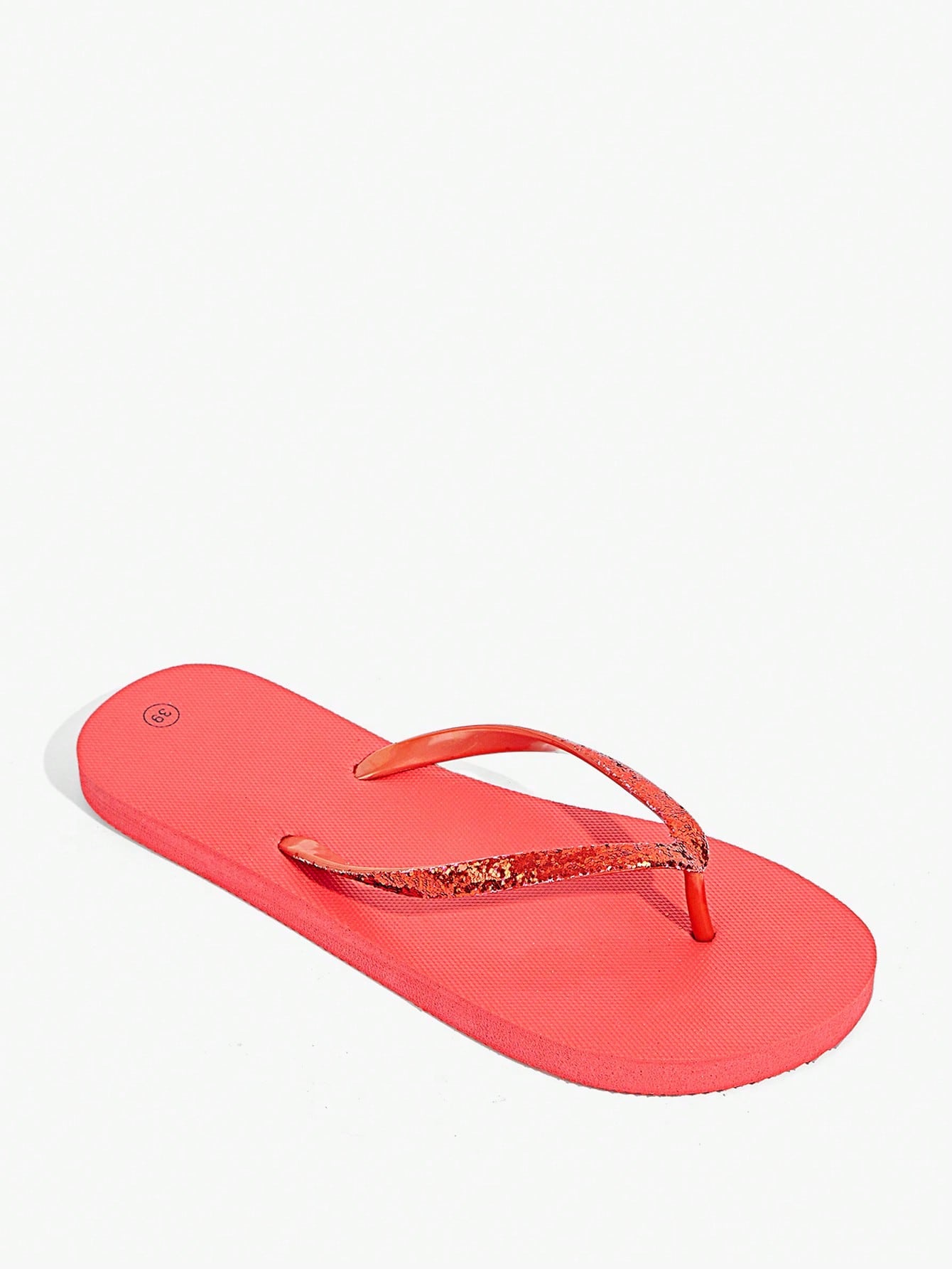 Pair of women’s apricot flat flip-flops with a glitter upper and plain design, suitable for beach, outdoor, home, and vacation wear.