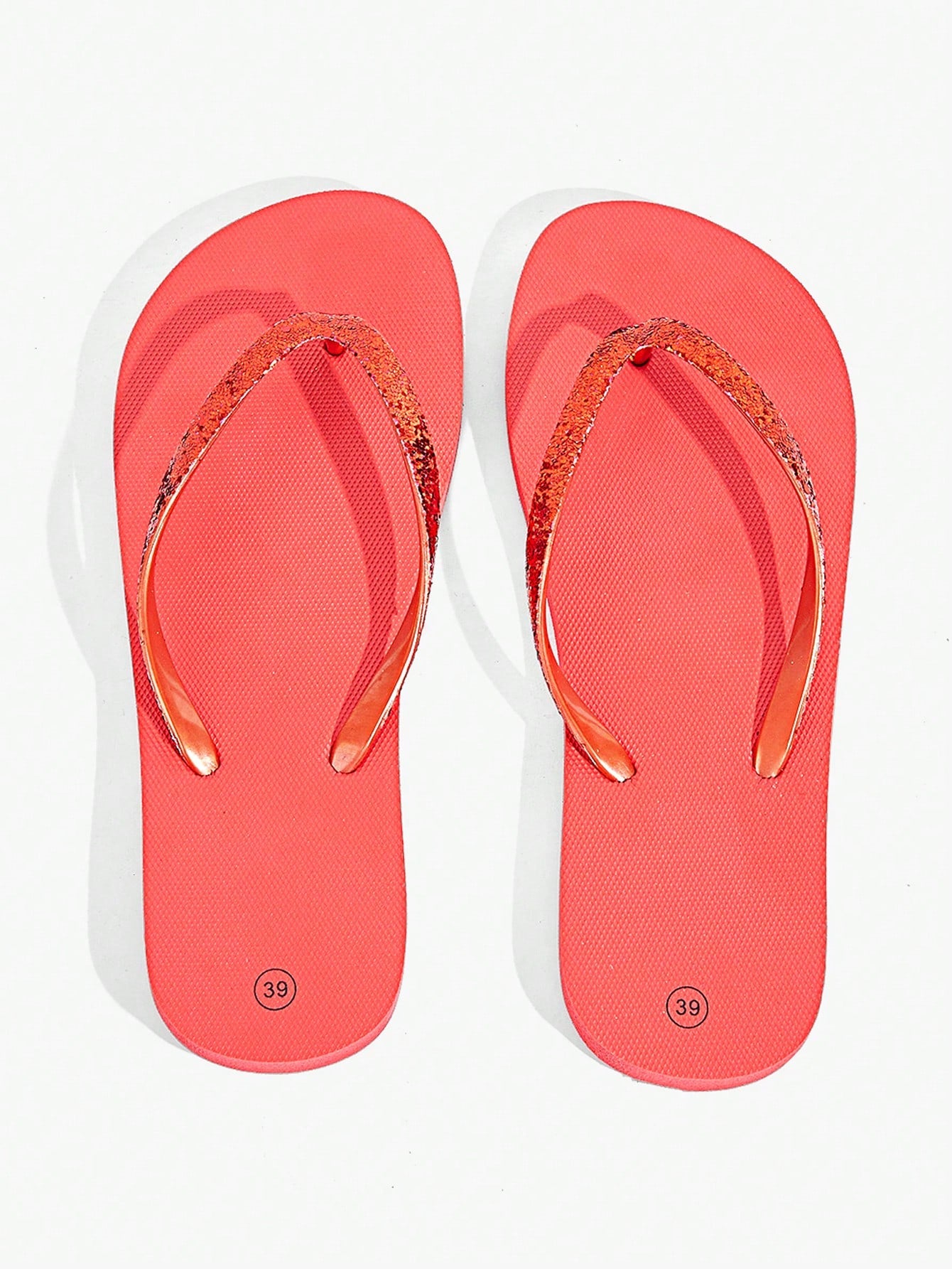 Pair of women’s apricot flat flip-flops with a glitter upper and plain design, suitable for beach, outdoor, home, and vacation wear.
