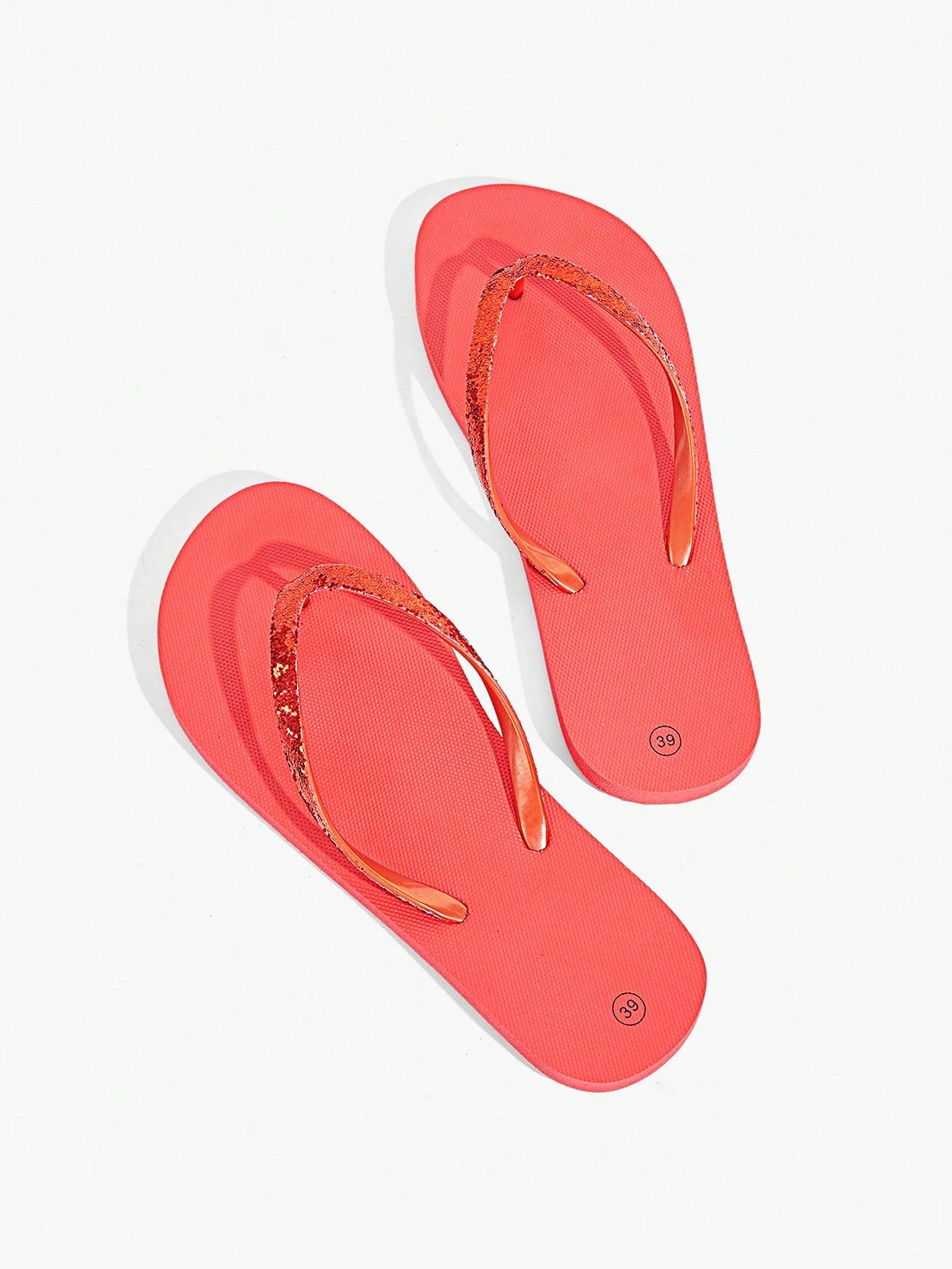 Pair of women’s apricot flat flip-flops with a glitter upper and plain design, suitable for beach, outdoor, home, and vacation wear.