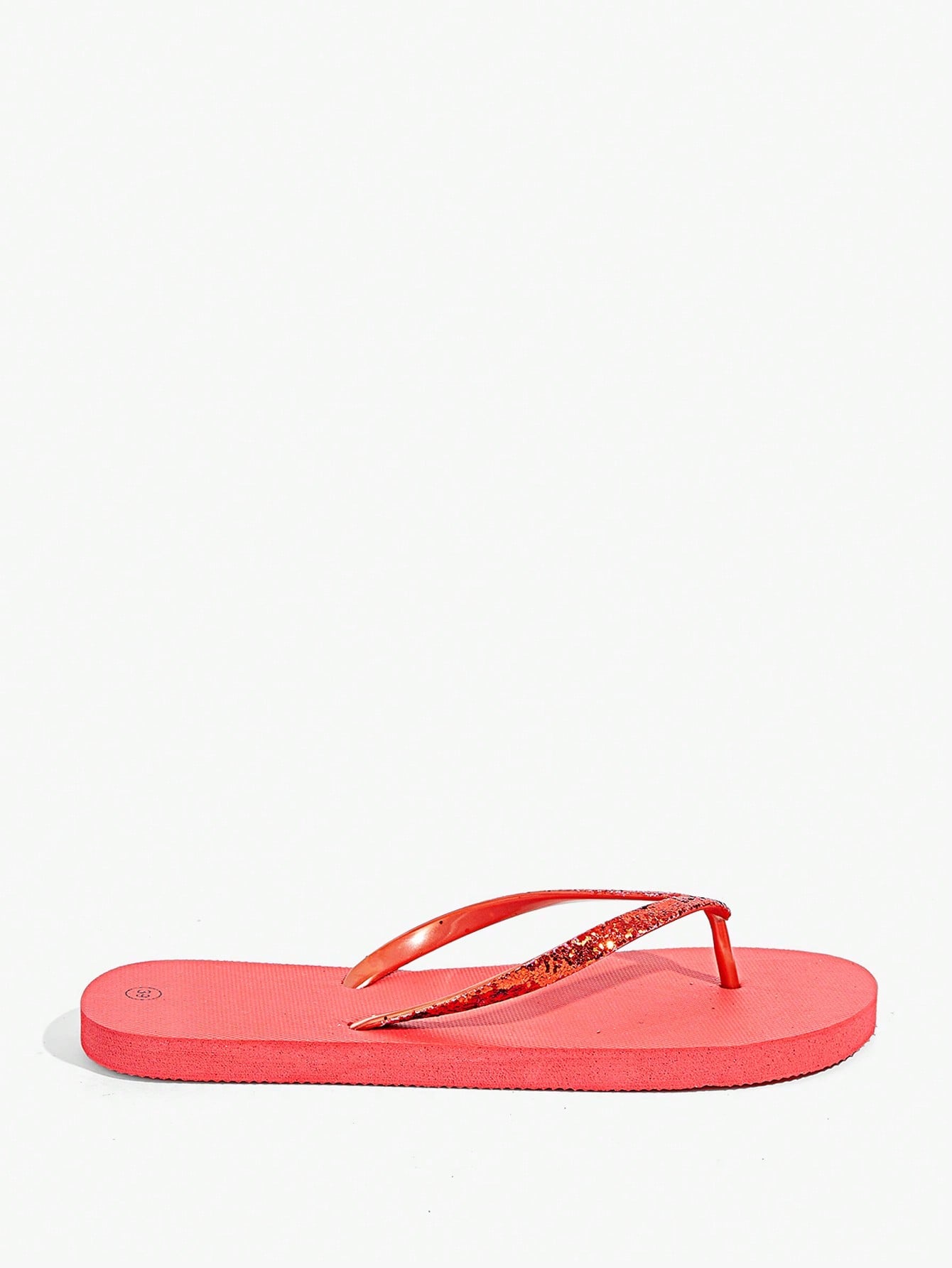 Pair of women’s apricot flat flip-flops with a glitter upper and plain design, suitable for beach, outdoor, home, and vacation wear.