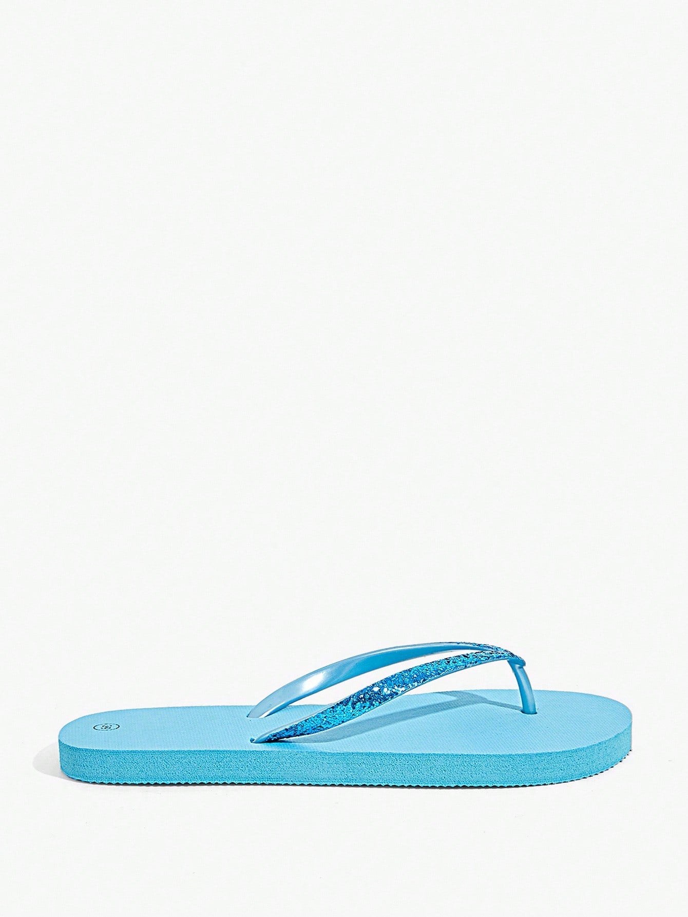 Pair of women’s apricot flat flip-flops with a glitter upper and plain design, suitable for beach, outdoor, home, and vacation wear.