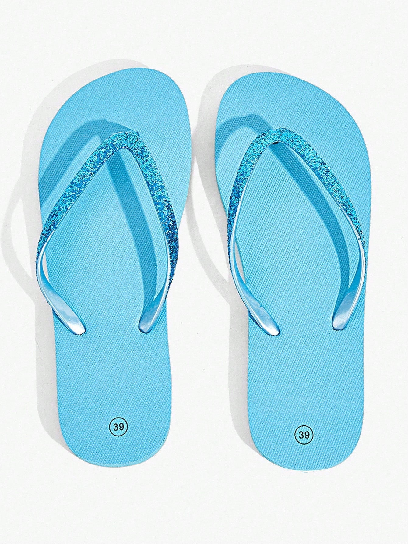 Pair of women’s apricot flat flip-flops with a glitter upper and plain design, suitable for beach, outdoor, home, and vacation wear.