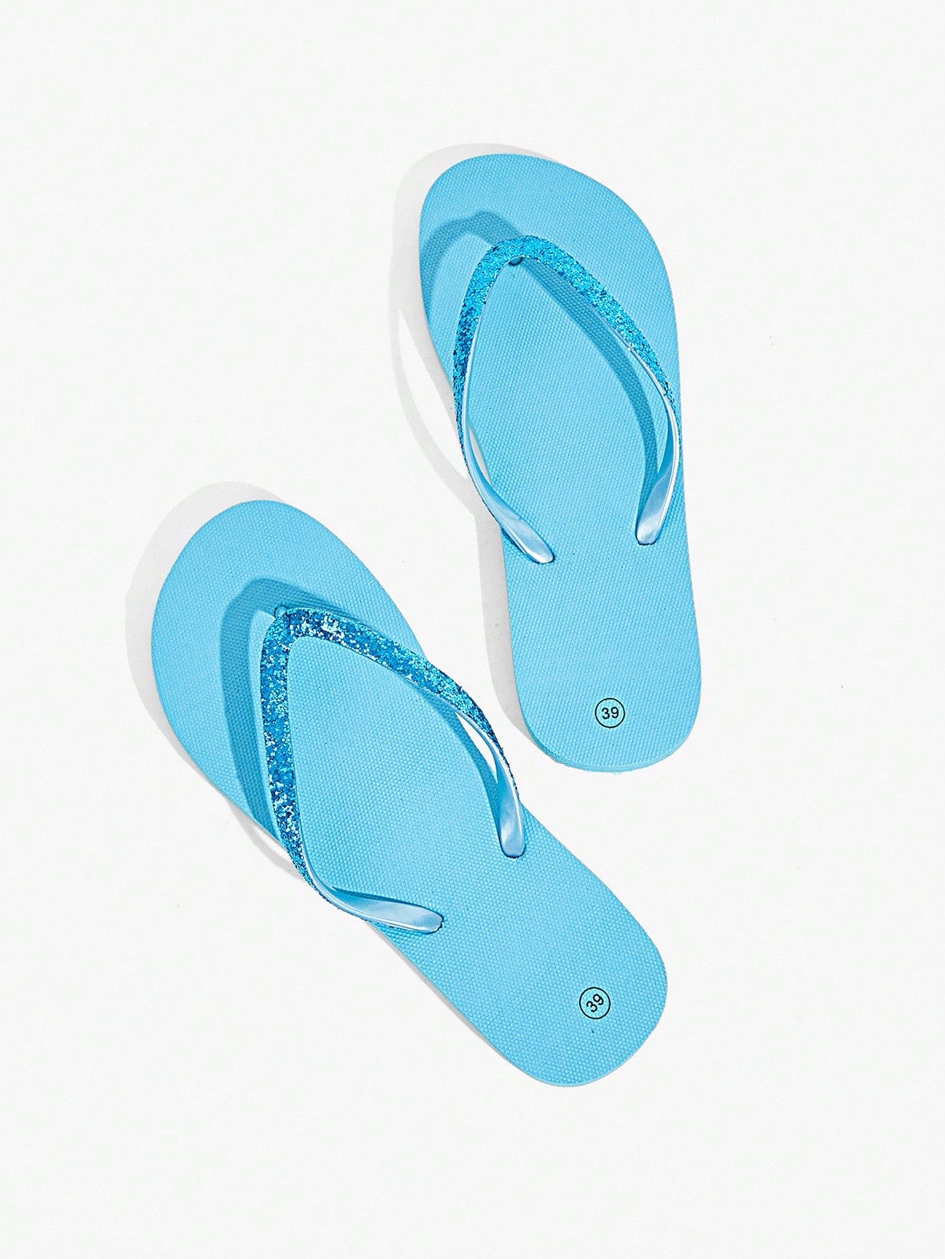 Pair of women’s apricot flat flip-flops with a glitter upper and plain design, suitable for beach, outdoor, home, and vacation wear.