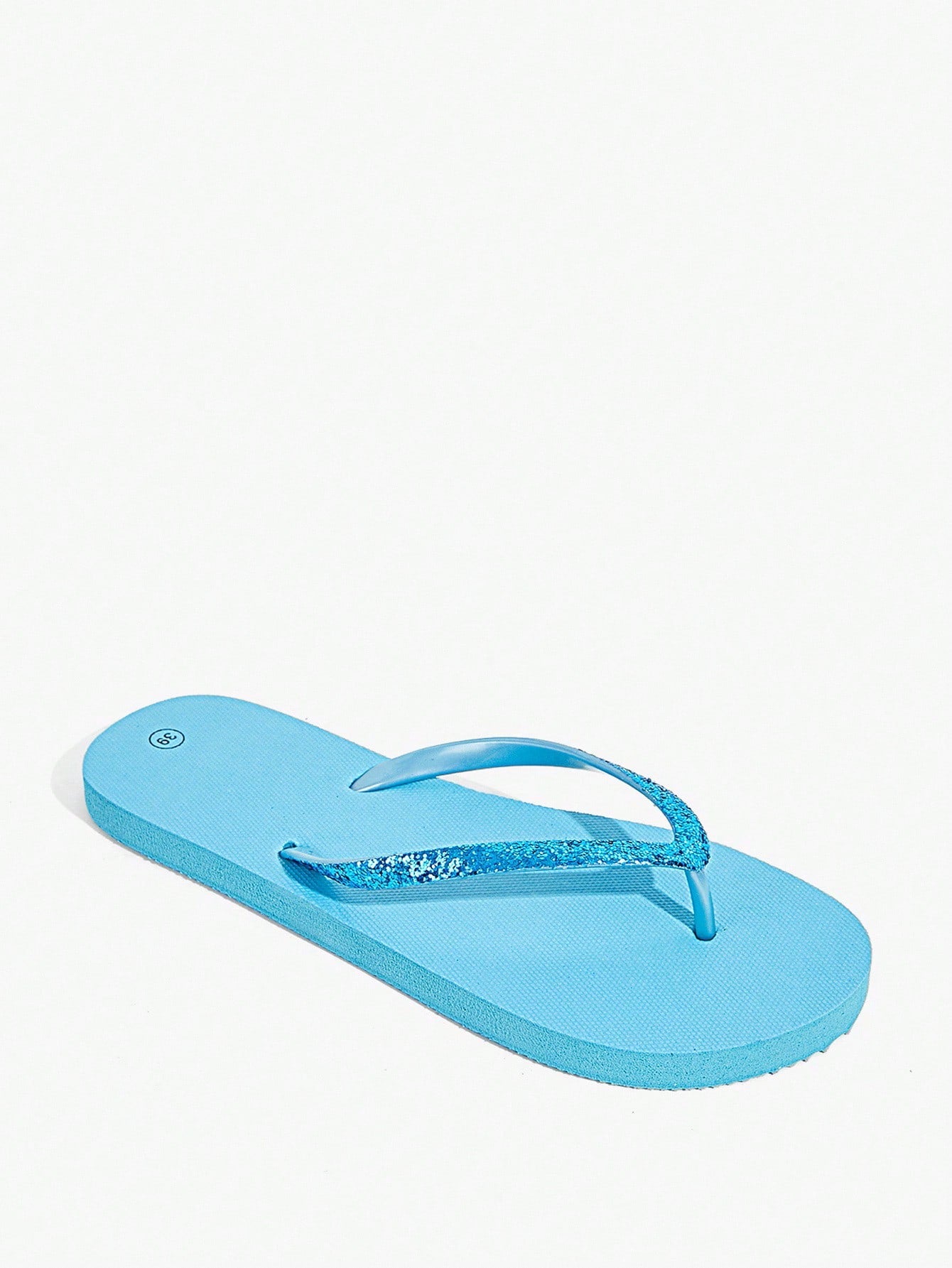 Pair of women’s apricot flat flip-flops with a glitter upper and plain design, suitable for beach, outdoor, home, and vacation wear.