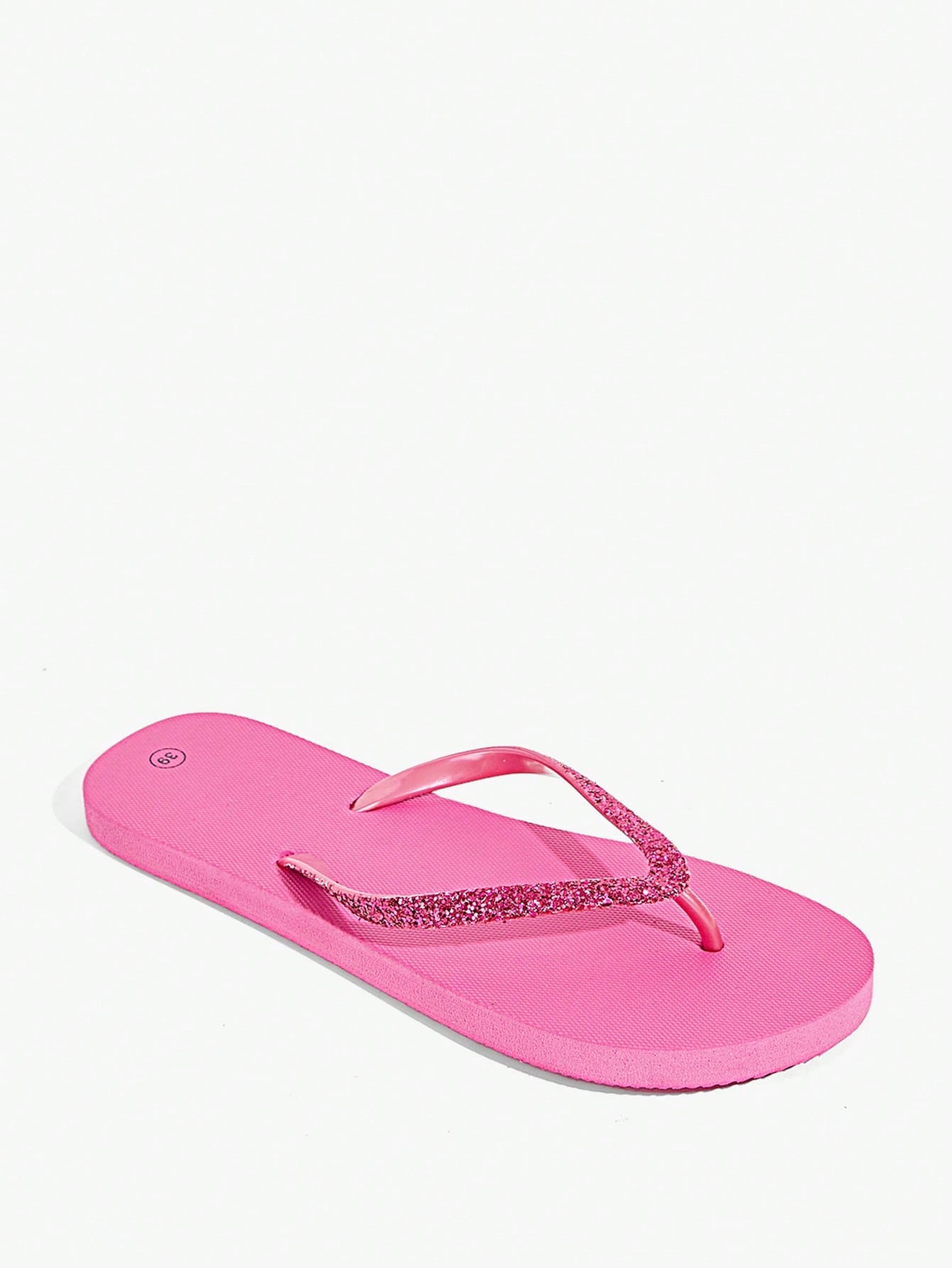 Pair of women’s apricot flat flip-flops with a glitter upper and plain design, suitable for beach, outdoor, home, and vacation wear.