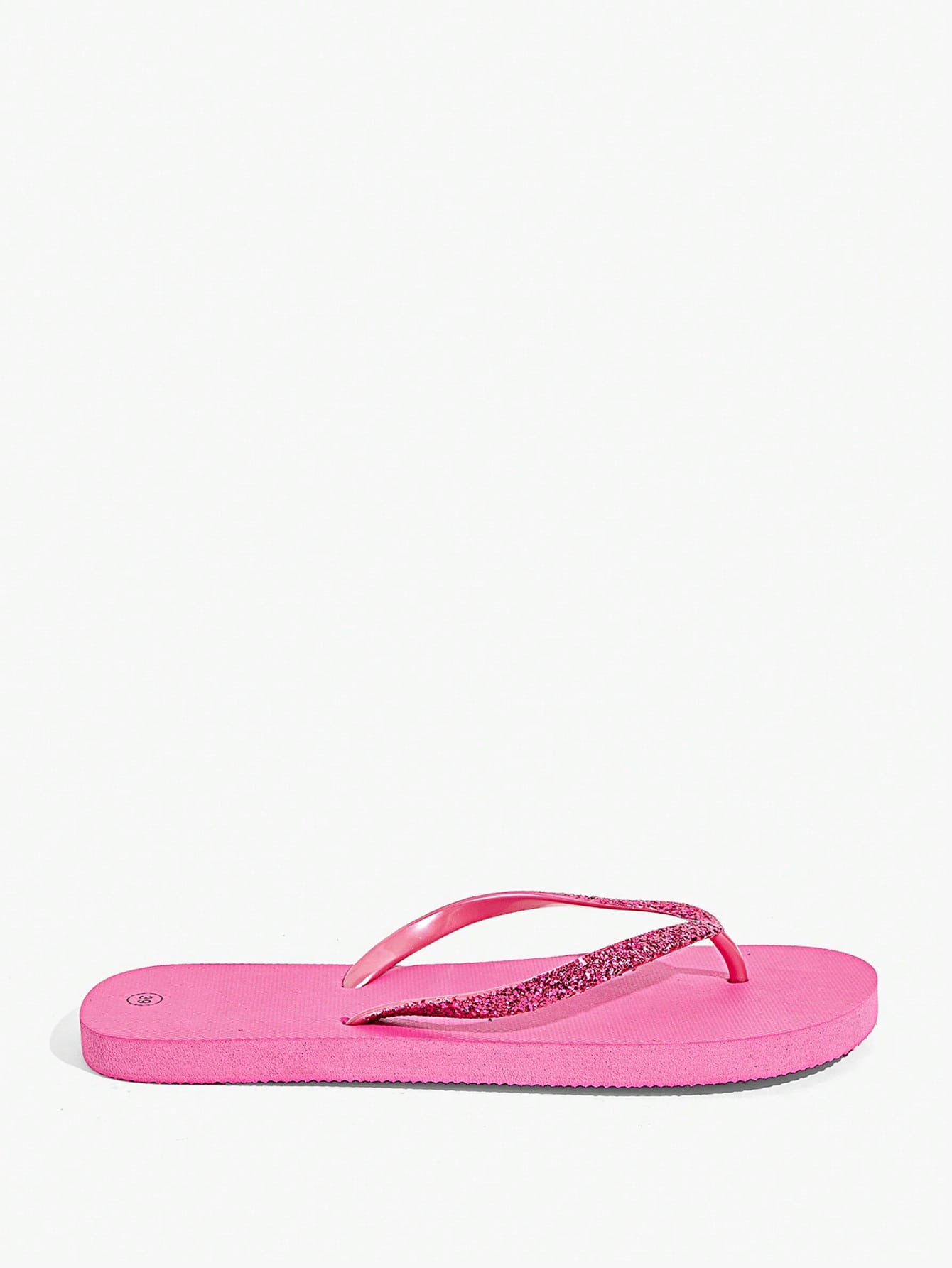 Pair of women’s apricot flat flip-flops with a glitter upper and plain design, suitable for beach, outdoor, home, and vacation wear.