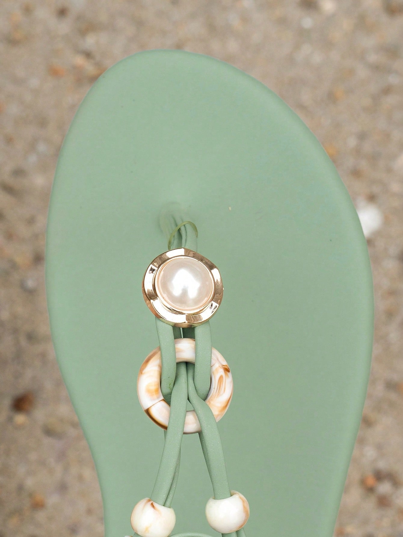 Women's beaded woven flip flop thong sandals with flat soft sole, toe-post design, and beach-style plant pattern detailing.