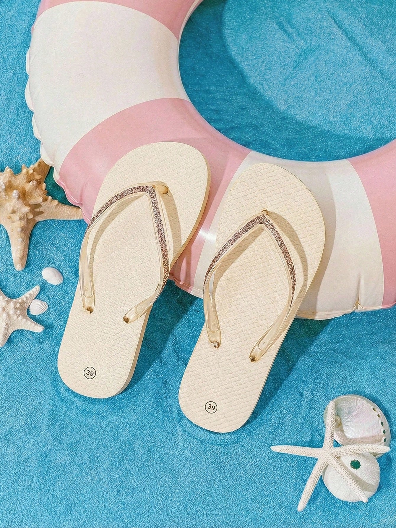 Pair of women’s apricot flat flip-flops with a glitter upper and plain design, suitable for beach, outdoor, home, and vacation wear.