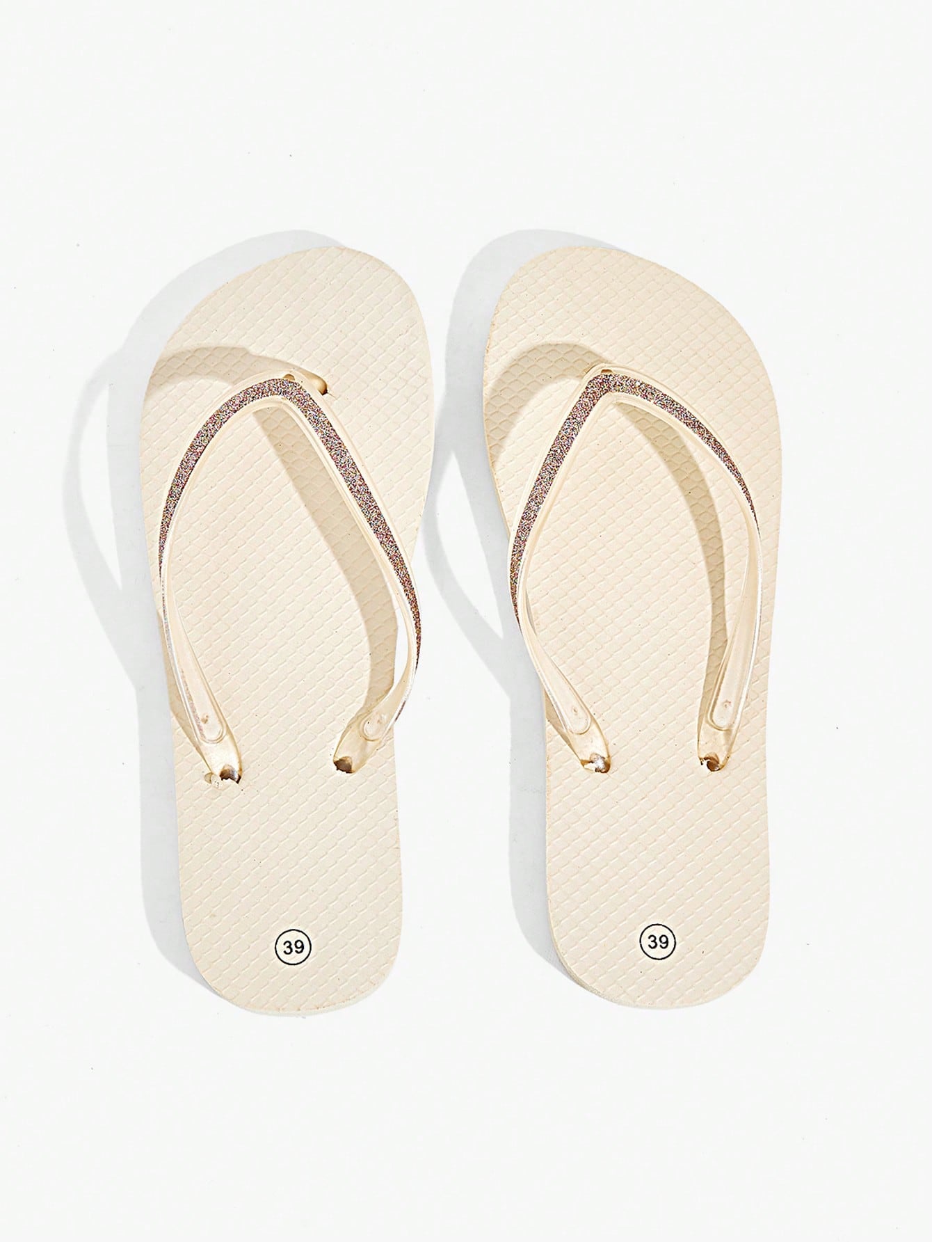 Pair of women’s apricot flat flip-flops with a glitter upper and plain design, suitable for beach, outdoor, home, and vacation wear.