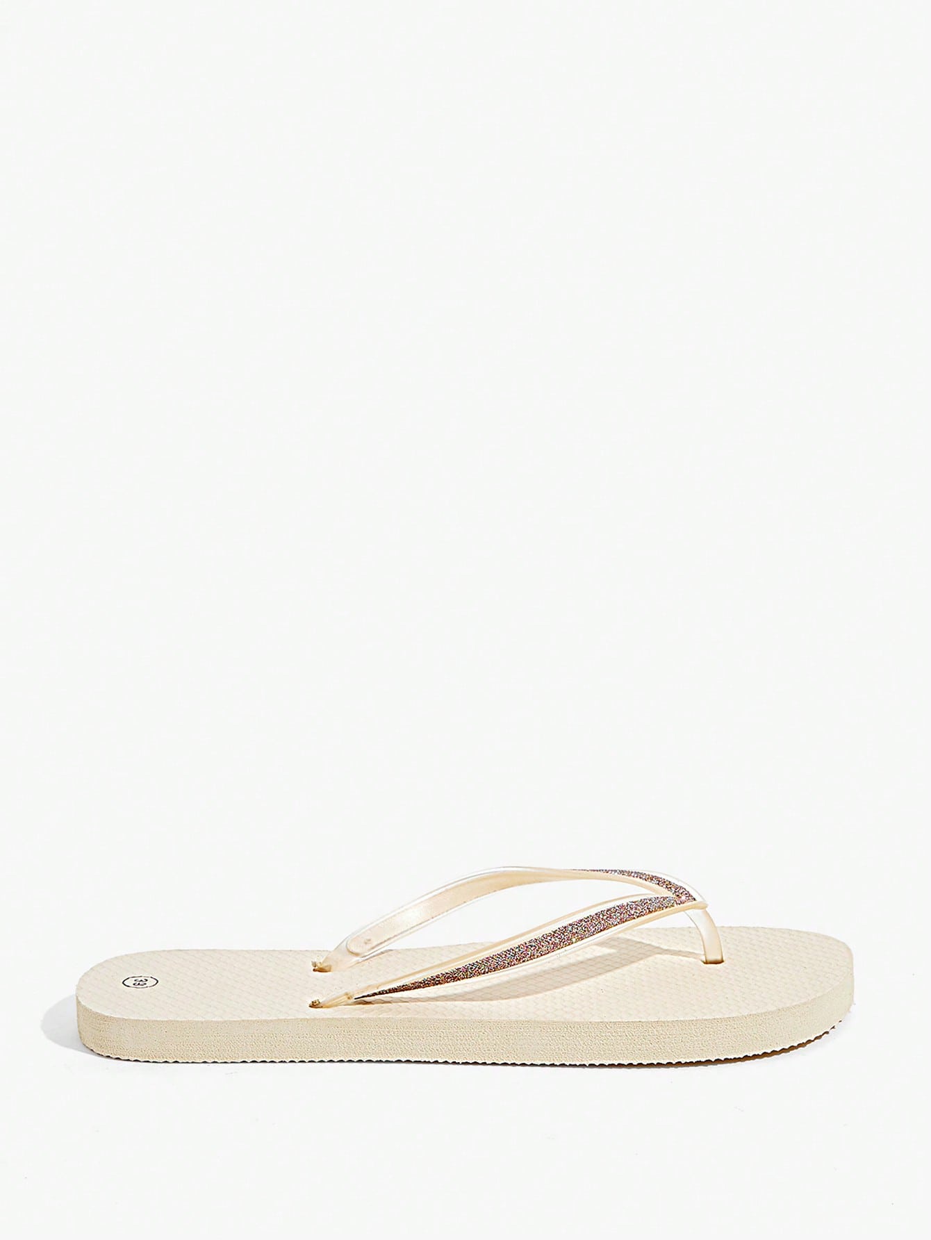 Pair of women’s apricot flat flip-flops with a glitter upper and plain design, suitable for beach, outdoor, home, and vacation wear.