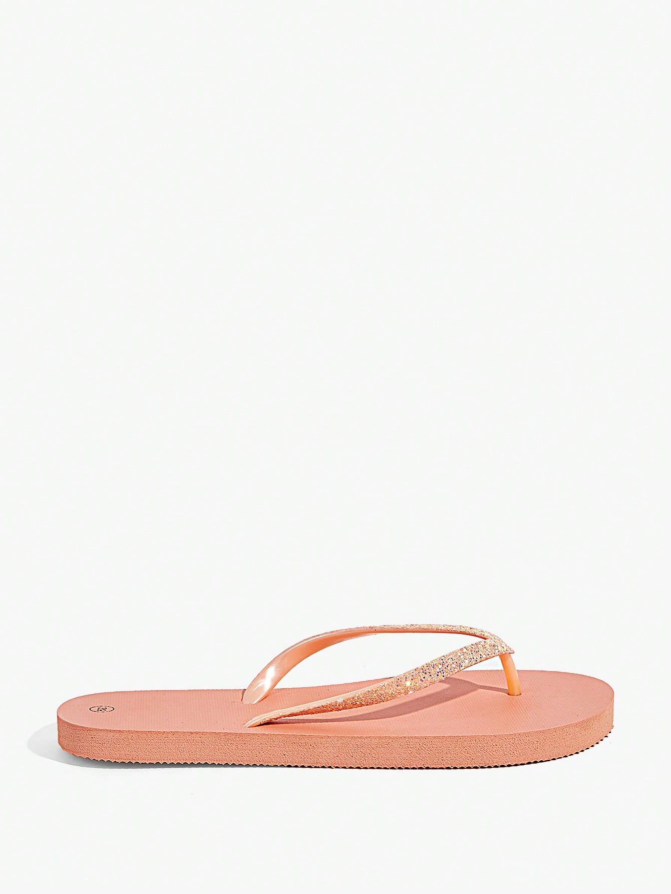 Pair of women’s apricot flat flip-flops with a glitter upper and plain design, suitable for beach, outdoor, home, and vacation wear.