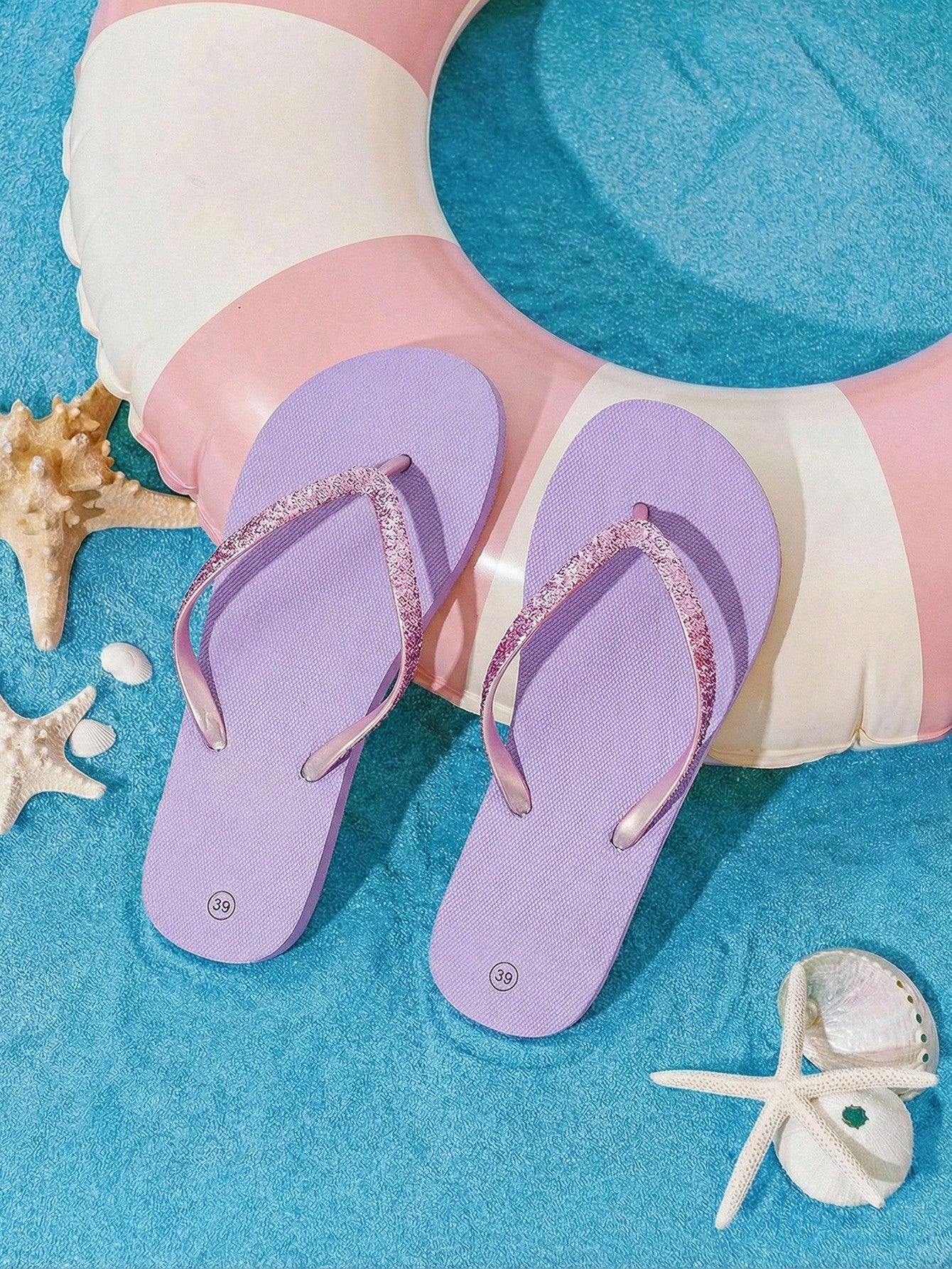 Pair of women’s apricot flat flip-flops with a glitter upper and plain design, suitable for beach, outdoor, home, and vacation wear.