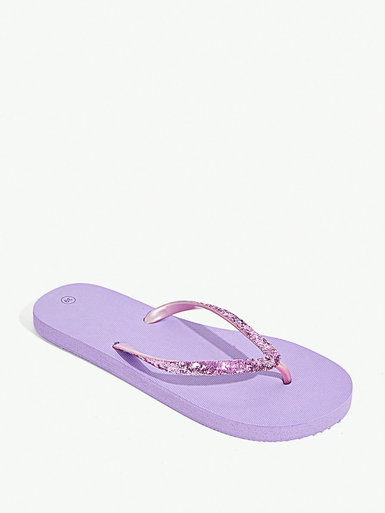Pair of women’s apricot flat flip-flops with a glitter upper and plain design, suitable for beach, outdoor, home, and vacation wear.
