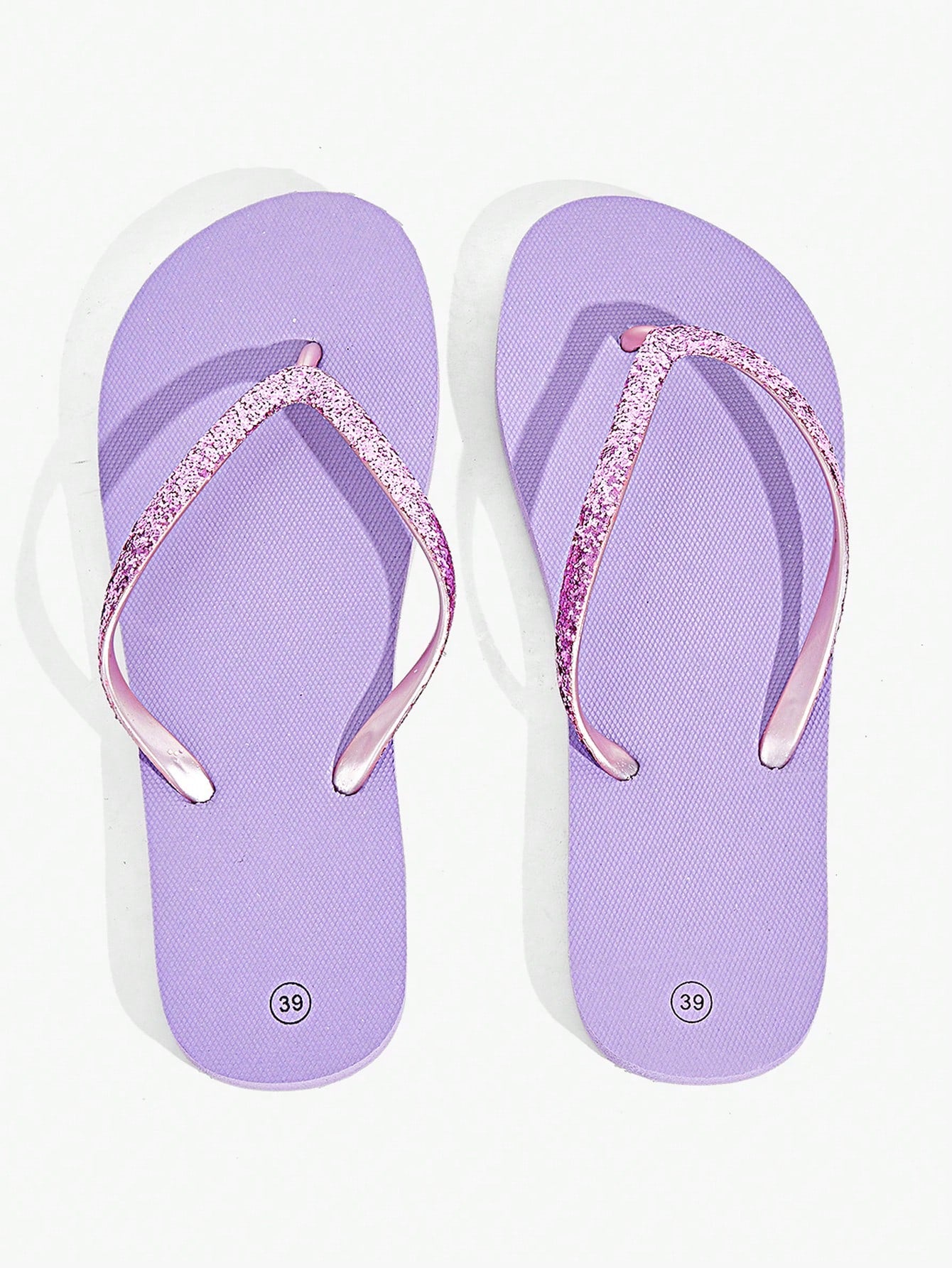 Pair of women’s apricot flat flip-flops with a glitter upper and plain design, suitable for beach, outdoor, home, and vacation wear.