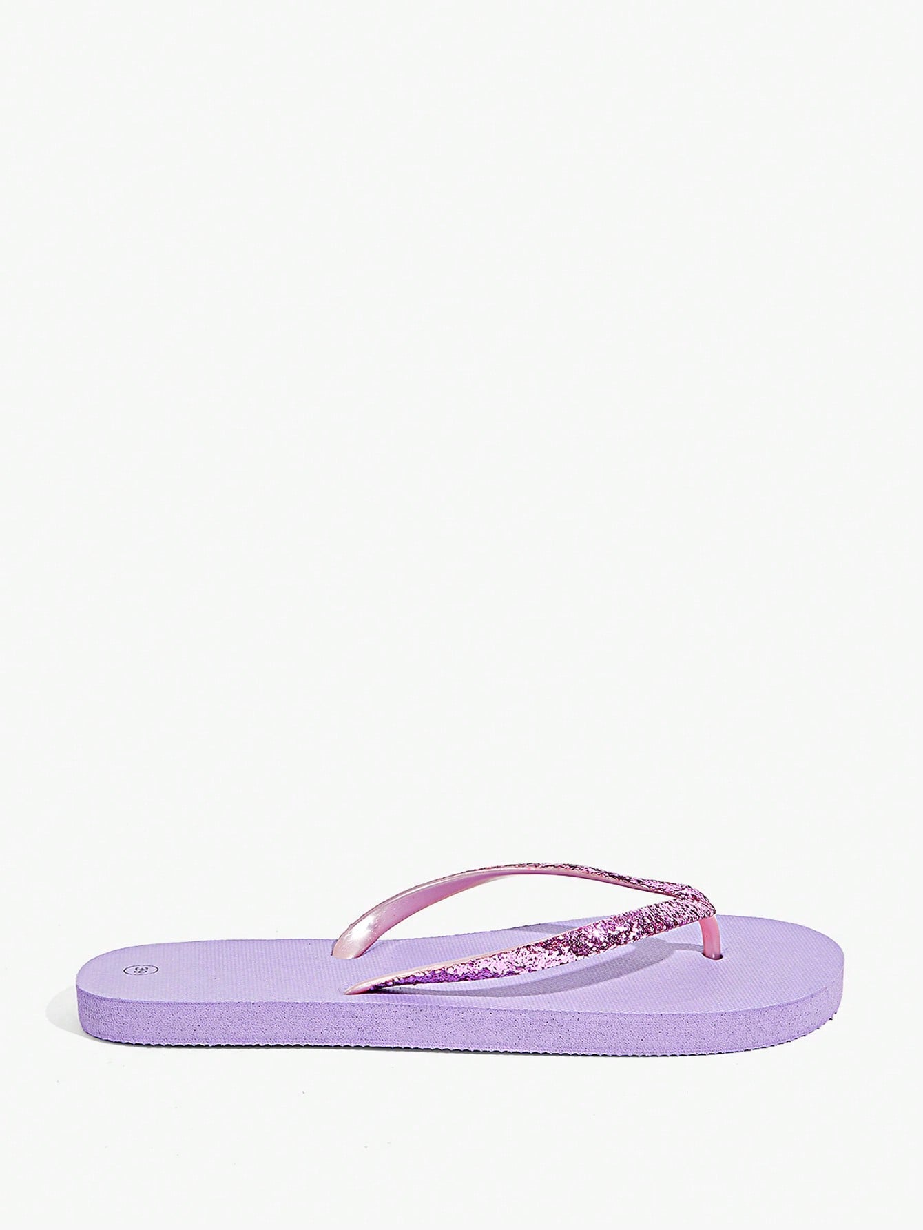 Pair of women’s apricot flat flip-flops with a glitter upper and plain design, suitable for beach, outdoor, home, and vacation wear.