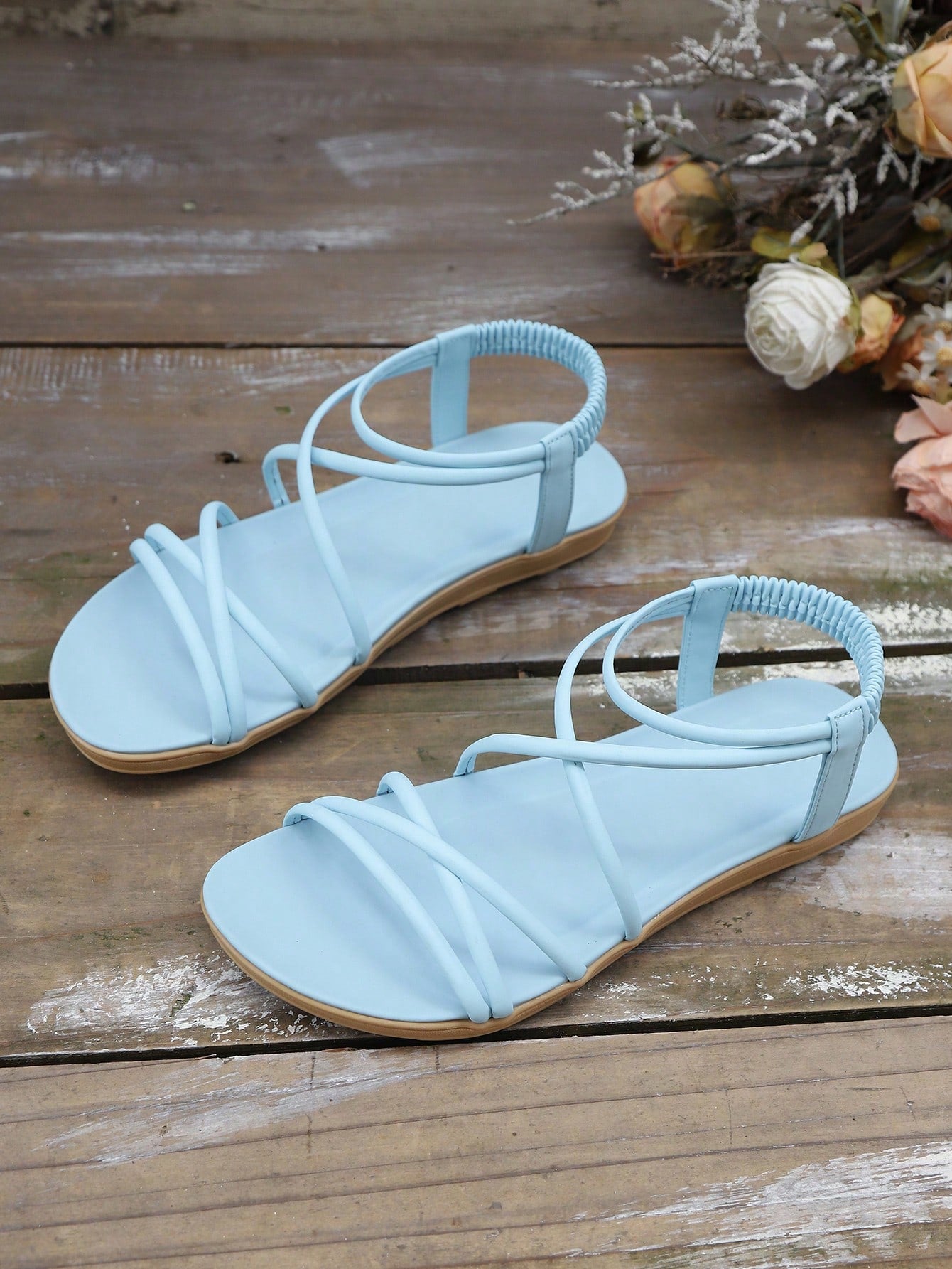 Women's khaki criss cross flat sandals with ankle strap and open toe design
