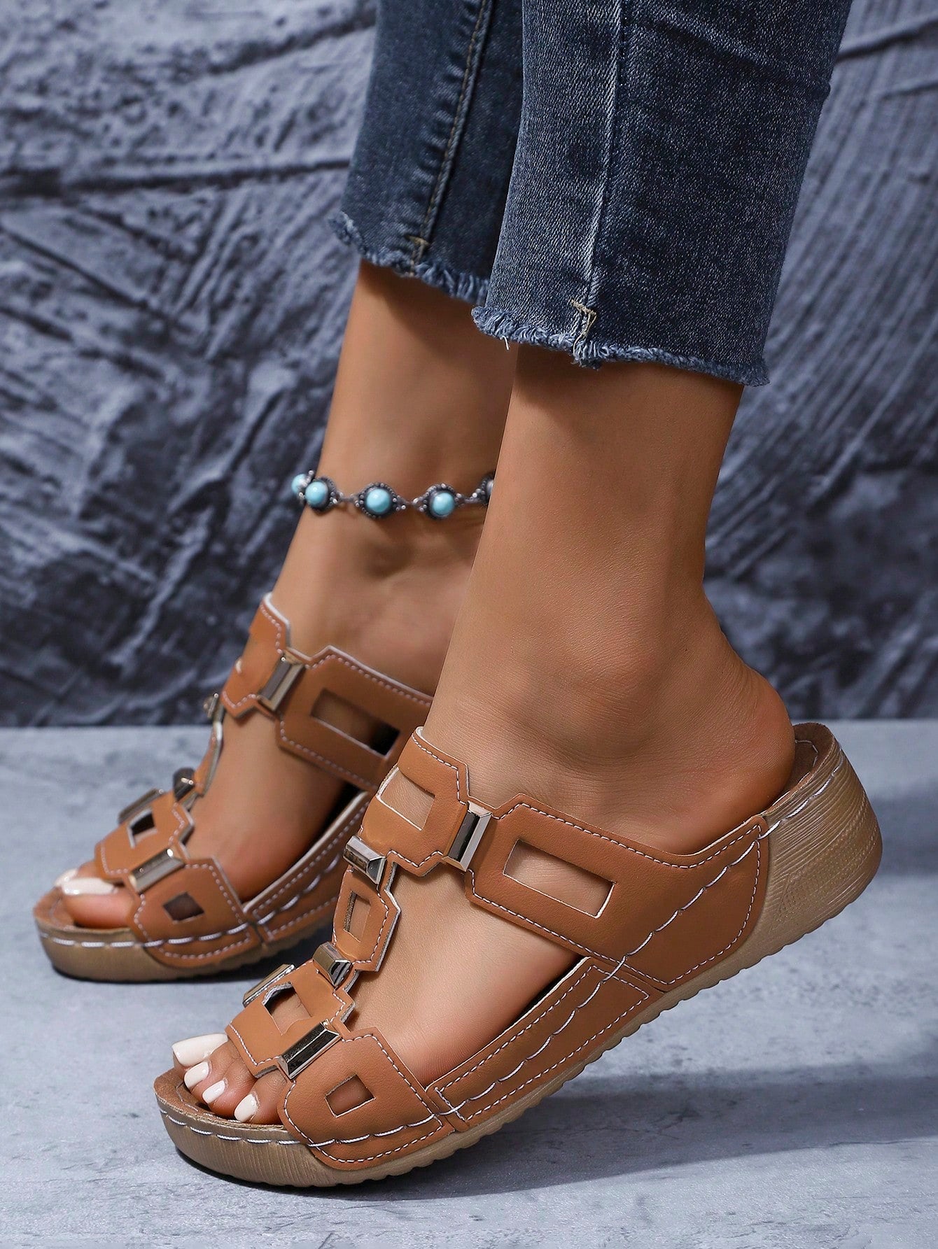 Women's open-toe wedge slide sandals with studded hollow-out upper, cross-over straps, buckle closure, and thick soft sole