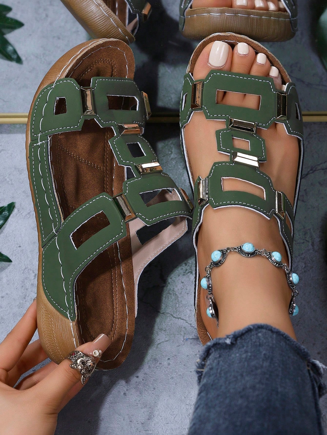 Women's open-toe wedge slide sandals with studded hollow-out upper, cross-over straps, buckle closure, and thick soft sole