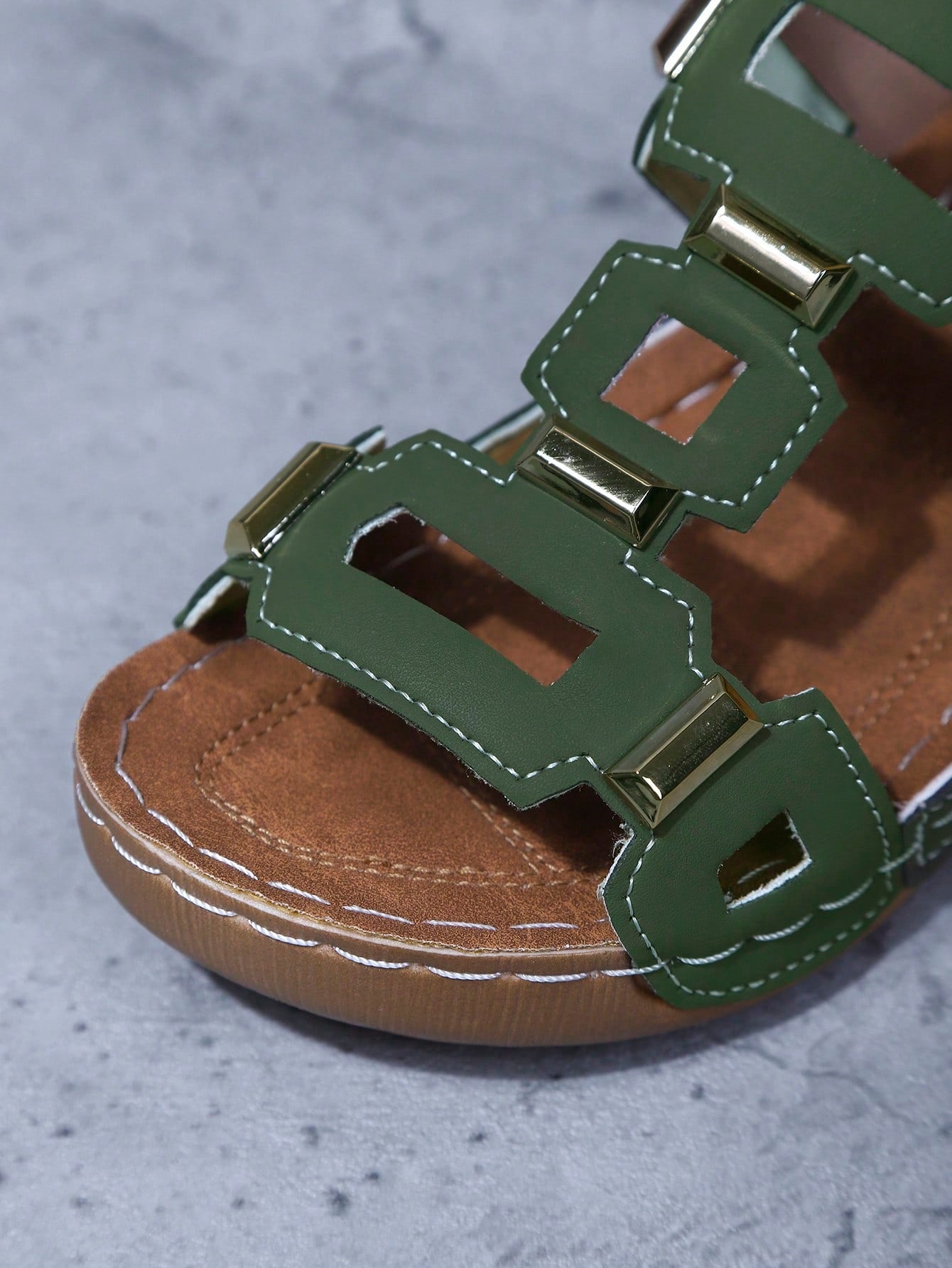Women's open-toe wedge slide sandals with studded hollow-out upper, cross-over straps, buckle closure, and thick soft sole