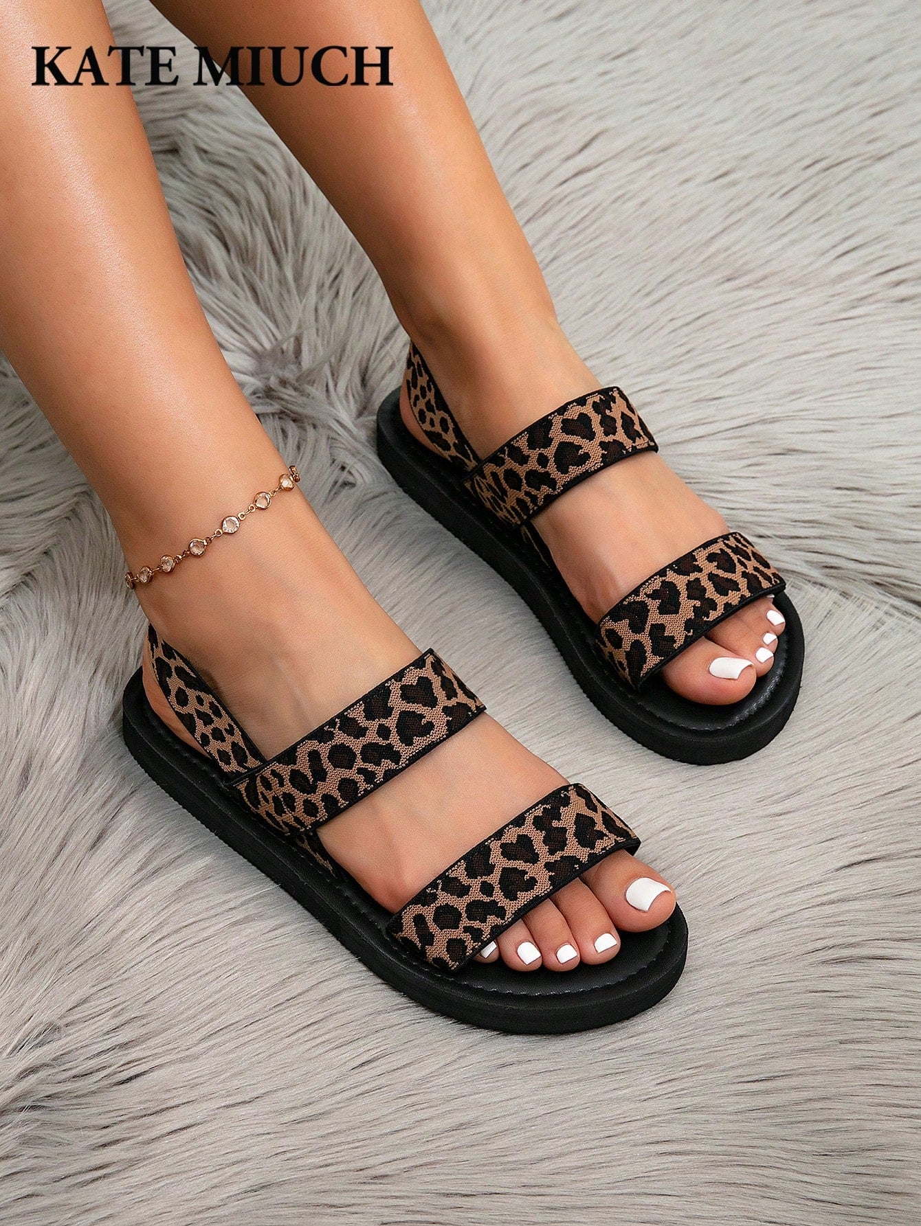 Women's flat slide sandals with ruched fabric, bow accent, and fringe detail, suitable for outdoor vacation wear.