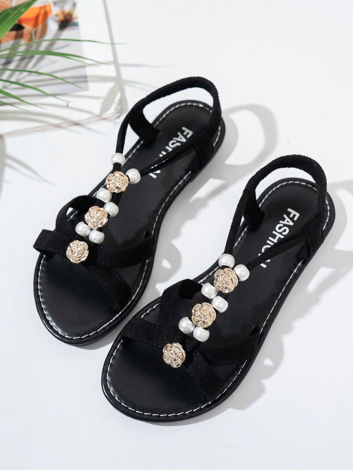 Women's beaded open-toe thong flat sandals in slip-on style for outdoor and beach casual wear.
